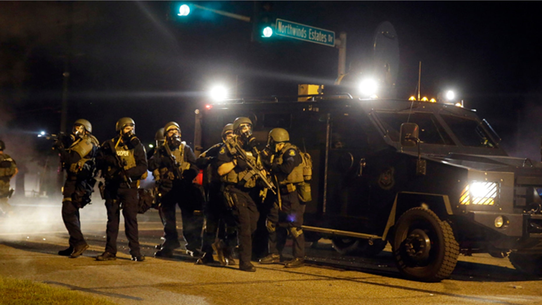 FILE: Aug. 18, 2014: Police in suburban St. Louis after the shooting of Michael Brown by a police officer started rancorous protests in Ferguson, Mo.