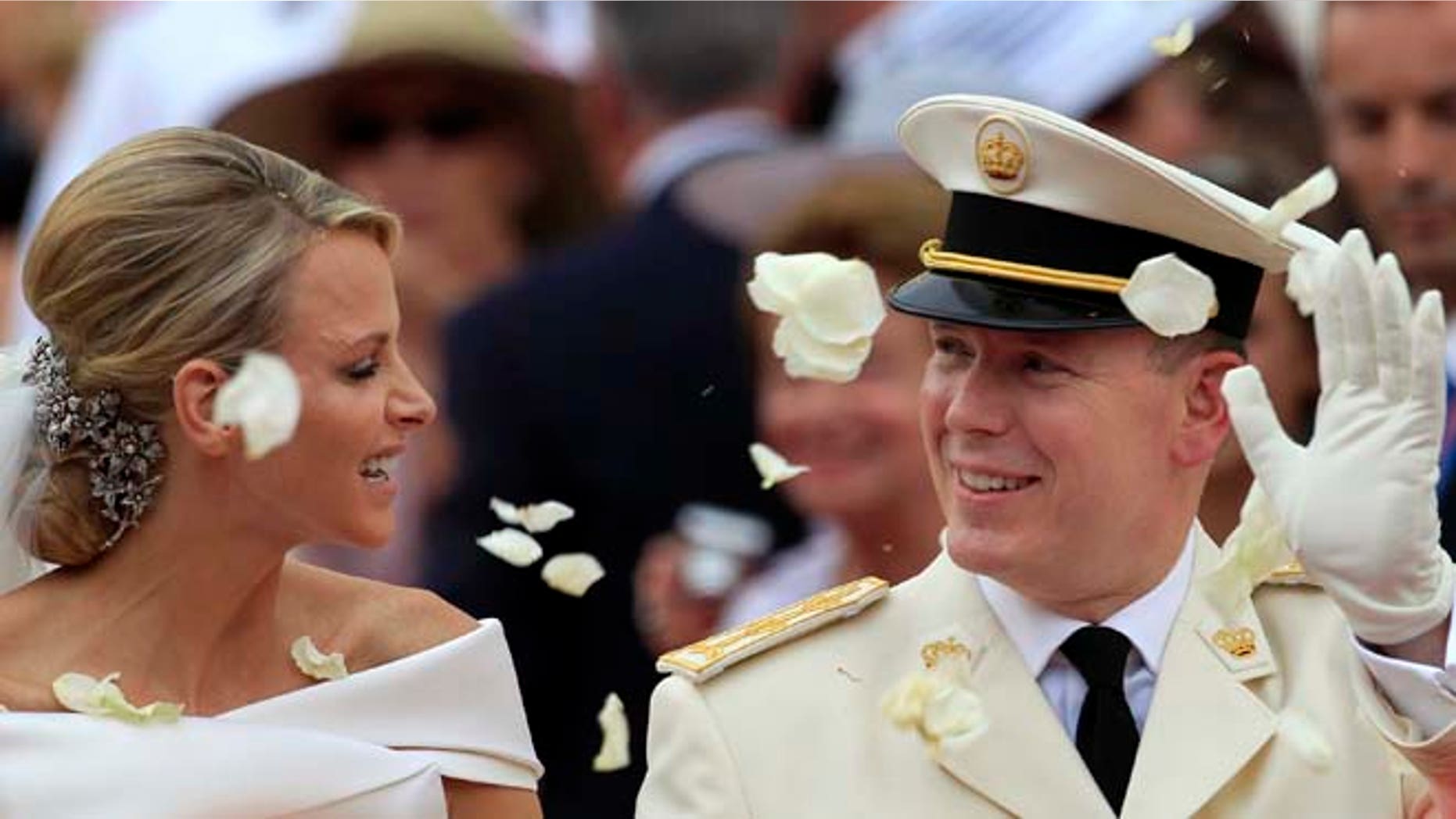 July 2, 2011: In this file photo, Prince Albert II of Monaco and Princess Charlene of Monaco depart from the Monaco palace after their religious wedding ceremony. (AP)