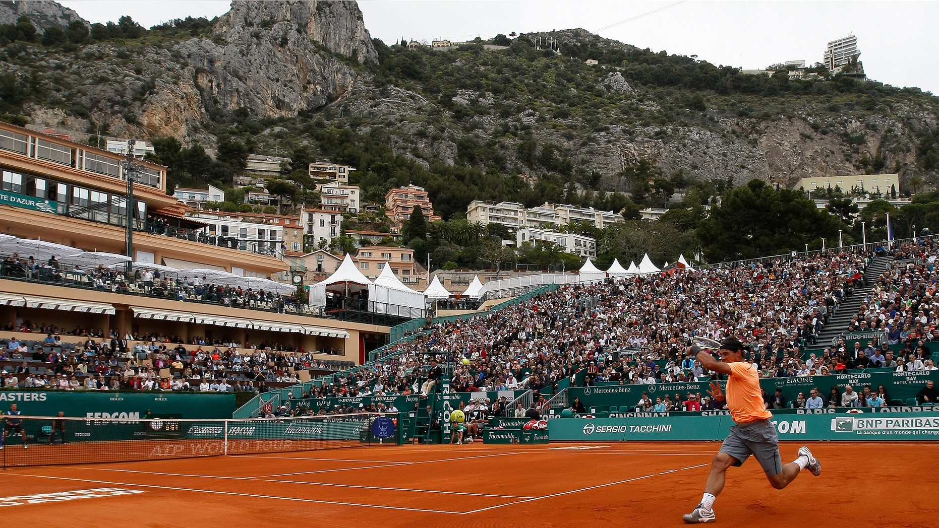 Spain's Rafael Nadal plays a return to Finland's Jarkko Nieminen, during their match of the Monte Carlo Tennis Masters tournament in Monaco, Wednesday, April 18, 2012. (AP Photo/Claude Paris)
