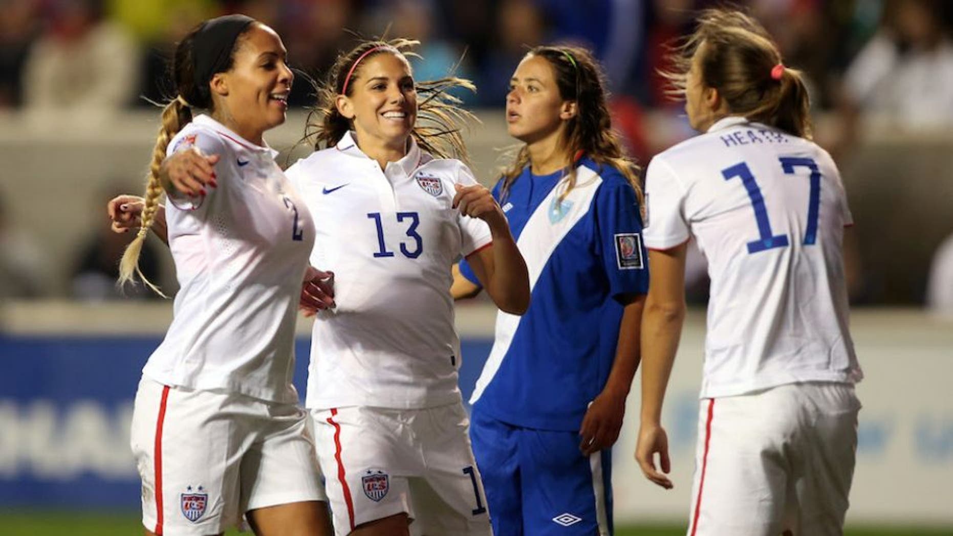 Oct 17, 2014; Bridgeview, IL, USA; USA player Tobin Heath (17) celebrates with teammates Alex Morgan (1) and Sydney Leroux (2) after scoring a goal against Guatemala during a women's World Cup qualifier soccer match at Toyota Park. Mandatory Credit: Jerry Lai-USA TODAY Sports