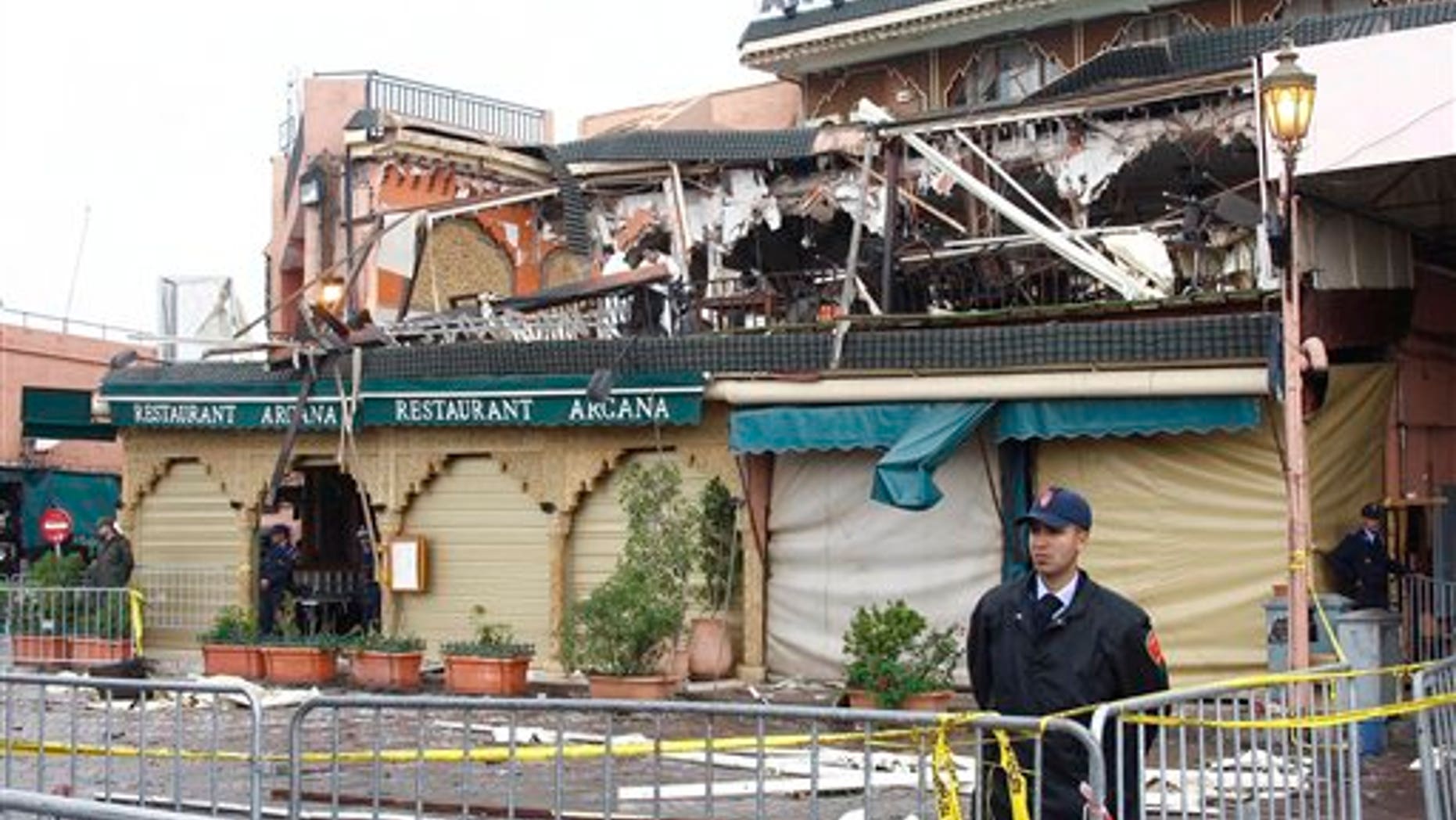 April 28: Police guard a damaged building after an explosion Thursday ripped through a cafe popular among foreign tourists in Marrakech, Morocco. The international police agency Interpol called the attack on a crowded tourist cafe in Marrakech a suspected suicide bombing Friday, as the government said two Canadians, two French citizens, a Dutchman and two Moroccans were among the 15 killed in the explosion. (AP)