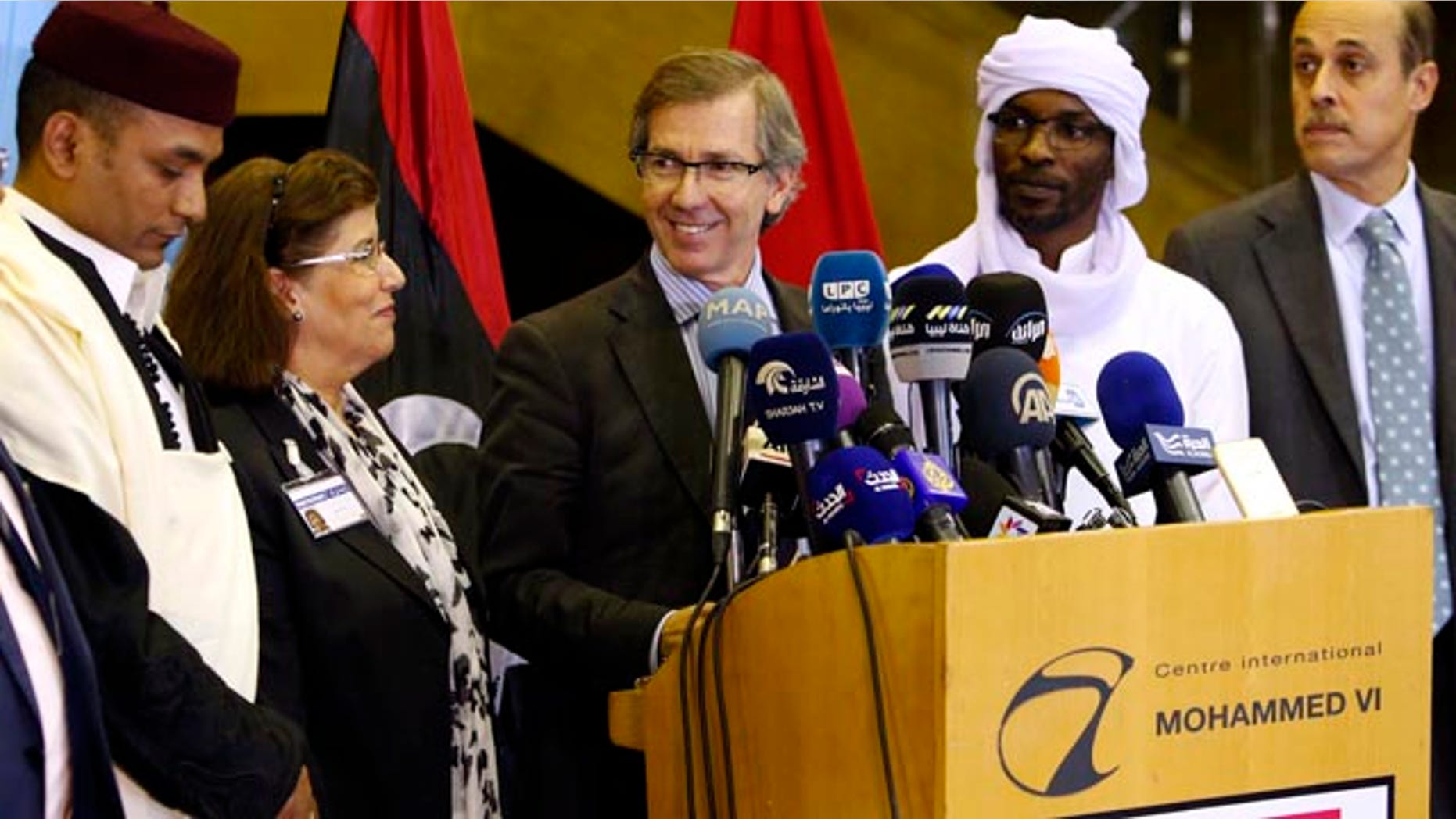 Oct. 8, 2015: United Nations envoy for Libya Bernardino Leon, center, makes an announcement to the media in Skhirat, Morocco. Leon proposed a national unity government for Libya after months of difficult talks between the north African country's two rival governments, but now it's up to the two sides and Libyans themselves to approve it. (AP Photo/Abdeljalil Bounhar)