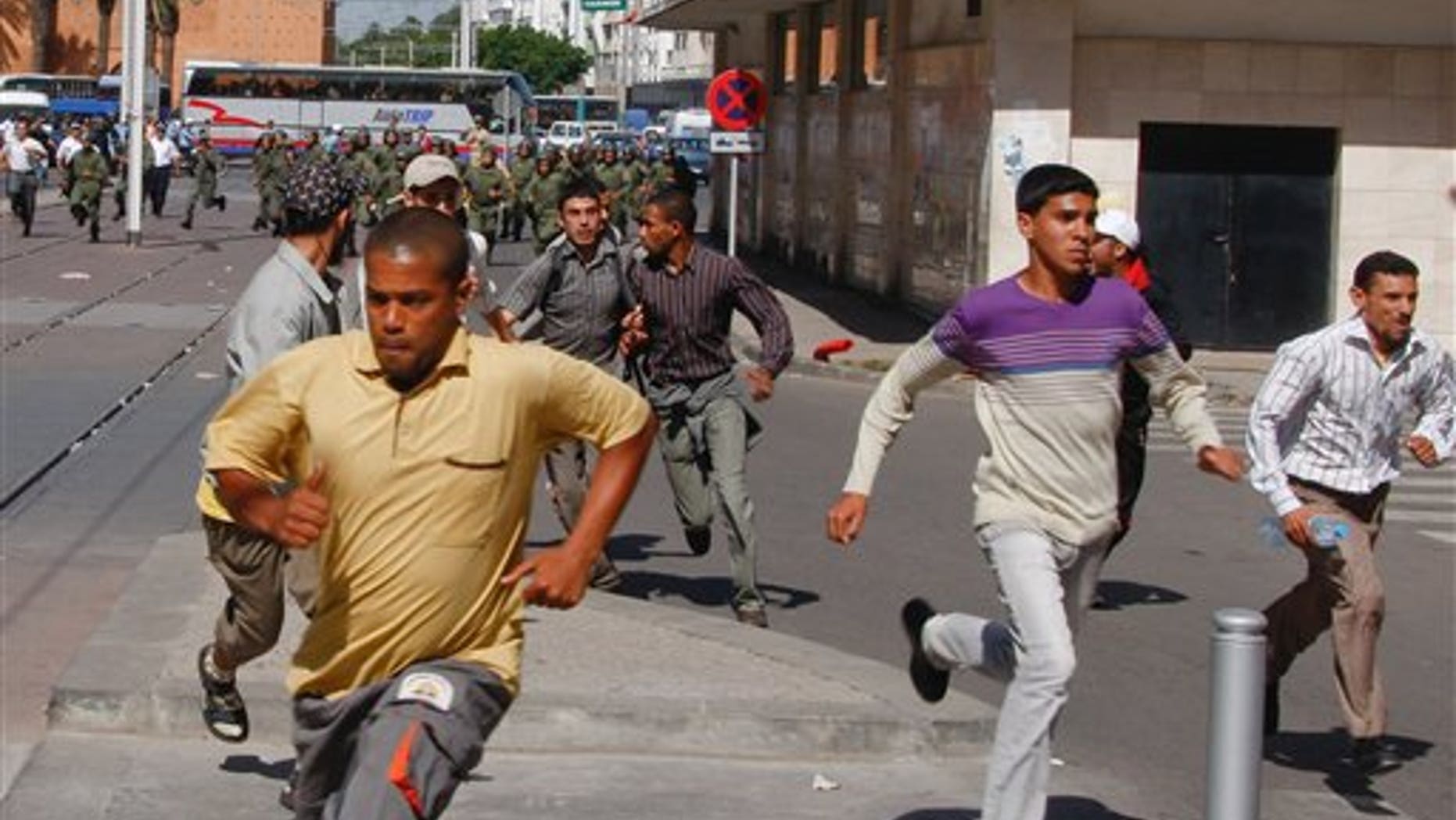 May 22: Moroccan police officers chase demonstrators as they break up a demonstration organized by the 20th February, the Moroccan Arab Spring movement, in Rabat, Morocco, in a mass popular call to bring more democracy into this North African kingdom. (AP)