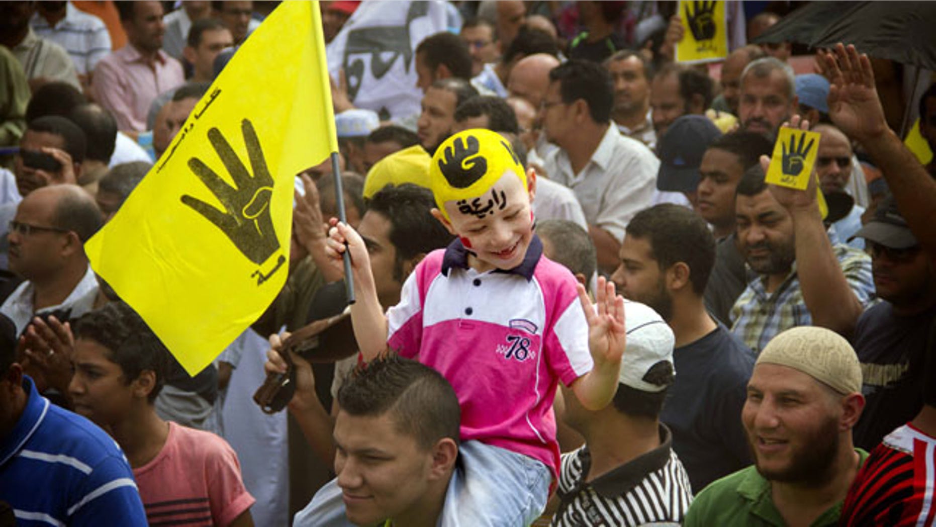 September 27, 2013: A young Egyptian boy participates in a demonstration by supporters of ousted President Mohammed Morsi in the Maadi district of Cairo, Egypt. (AP Photo/Hamada Elrasam, File)