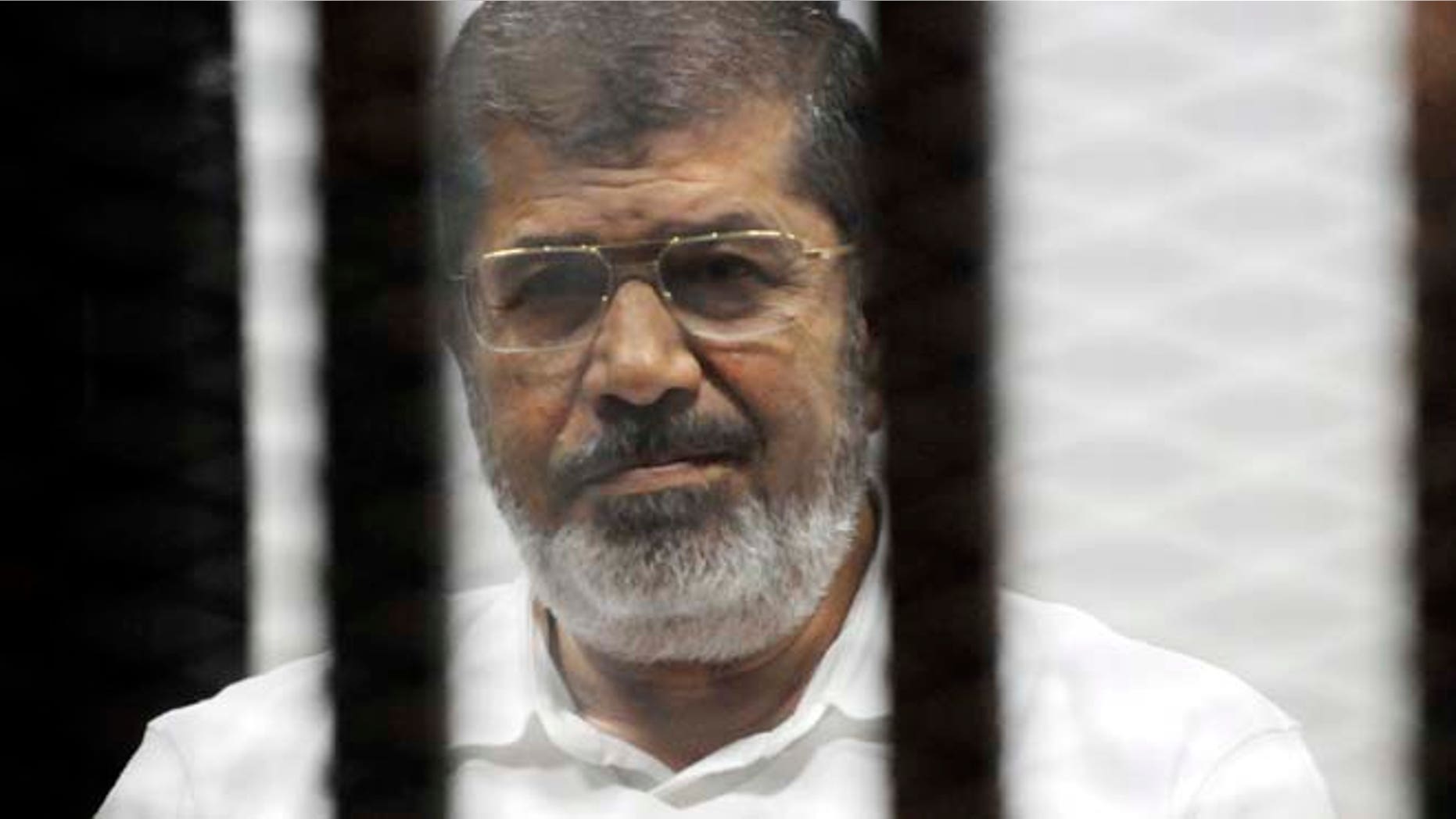 Nov. 3, 2014: Egypt's ousted Islamist President Mohammed Morsi sits in the defendant cage in the Police Academy courthouse during a court hearing on charges of inciting the murder of his opponents, in Cairo, Egypt. (AP)