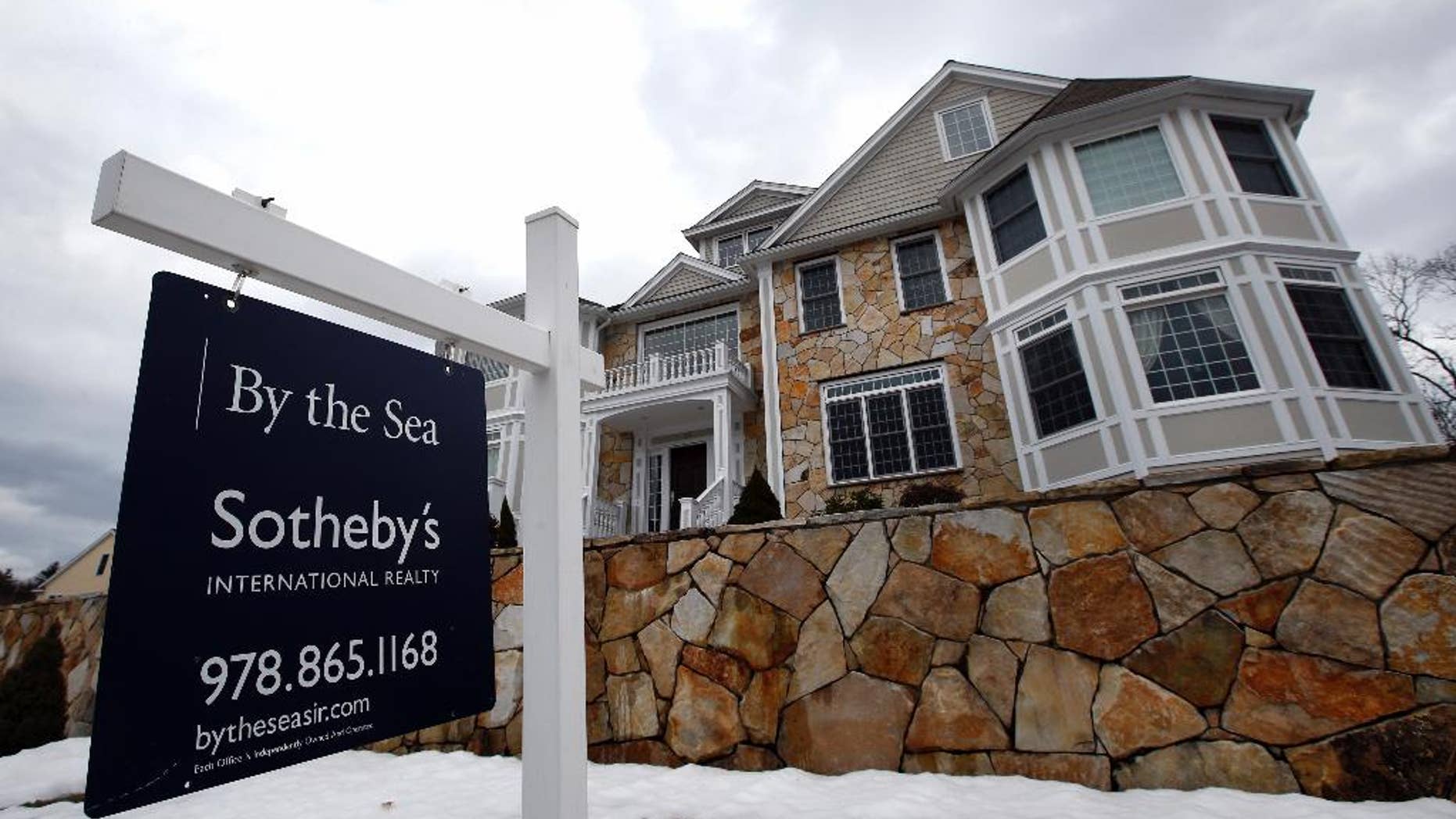 This March 21, 2014 photo shows a home for sale in North Andover, Mass. Freddie Mac, the mortgage company, releases weekly mortgage rates on Thursday, April 24, 2014. (AP Photo/Elise Amendola)