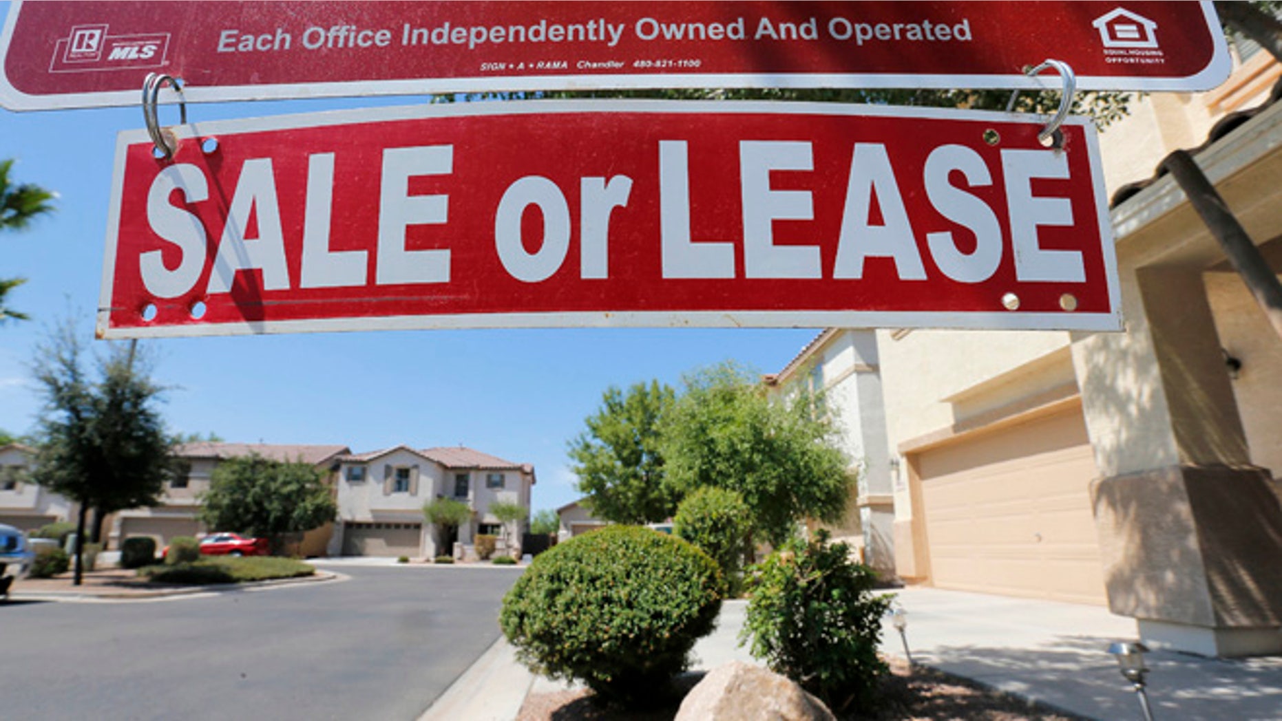 FILE -- July 30, 2013: A home is seen for sale in Gilbert, Ariz.
