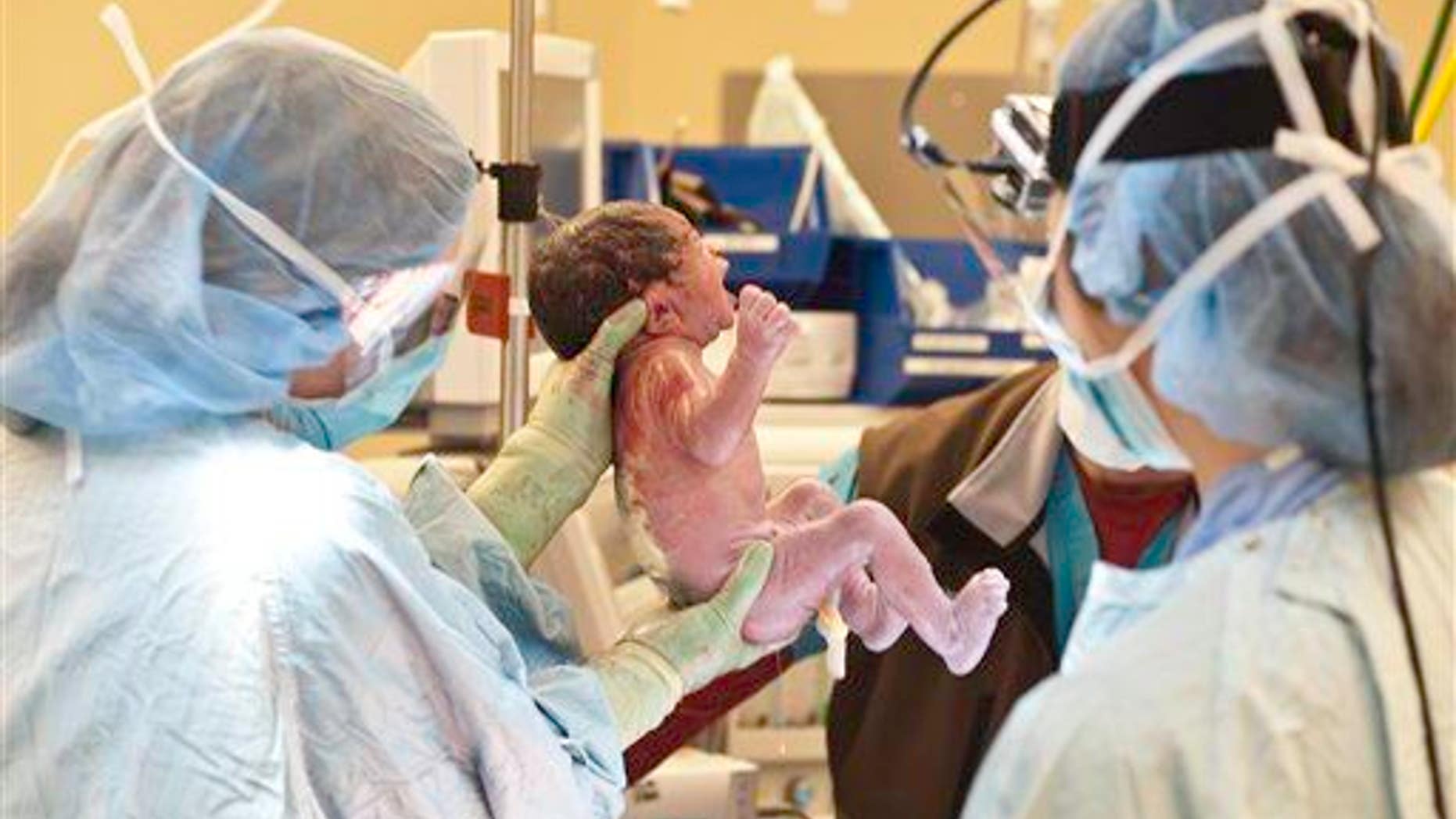 A newborn baby is shown.