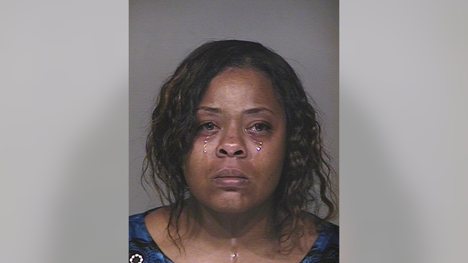 This photo provided by Scottsdale police, Shanesha Taylor is shown. Taylor, 35, had an important job interview last month at an insurance company across town in Scottsdale. But she couldn’t find a babysitter for her 2-year-old son and 6-month old baby. She made the decision to leave her children in her Dodge Durango outside the office where she was interviewing with the key still in the ignition. That ill-fated decision landed the mother of two in Maricopa County Superior Court Monday, April 7, 2014, where she was arraigned on two charges of child abuse. Neither Taylor nor her court-appointed attorney has responded to requests for comment. (AP Photo/Scottsdale police)