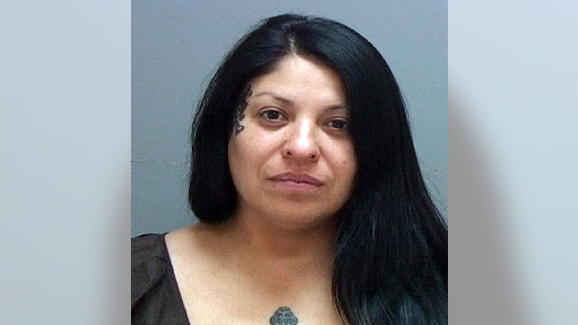 This photo provided by the Salt Lake County Sheriff's Office shows Lisa Egersdorf, accused of driving her teenage son by a gas station to shoot at rival gang members after picking him up from school. Prosecutors say Egersdorf was behind the wheel of a Toyota Corolla when her 17-year-old son fired several shots at people he’d been fighting with at his Salt Lake City school. (AP Photo/Salt Lake County Sheriff Office)