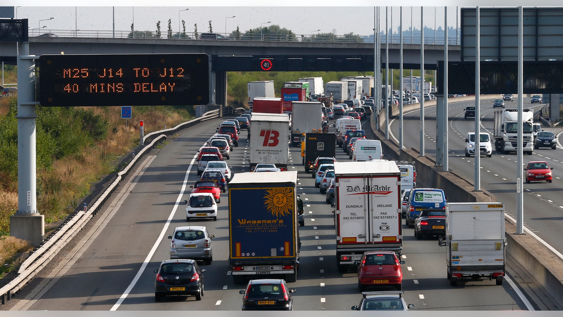 Heavy traffic is seen on the M25 motorway near Heathrow Airport west of London August 16, 2013. REUTERS/Eddie Keogh (BRITAIN - Tags: TRANSPORT TRAVEL) - RTX12O1T