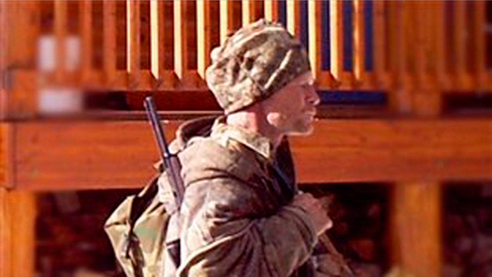 In this undated photo provided by the Iron County Sheriff's Office in January, a man is seen walking past a cabin in the remote southern Utah wildness near Zion National Park. Authorities believe the man in the photo, captured by a motion-triggered surveillance camera sometime in December, is a suspect responsible for more than two dozen cabin burglaries over the past five years.