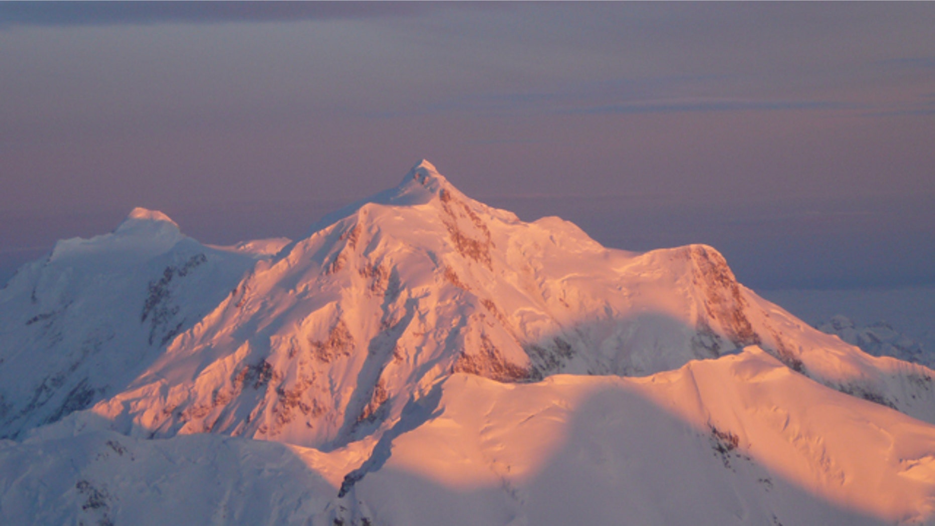 Beautiful but deadly? Light escapes through a break in the clouds over Mt. Hunter in Denali National Park.
