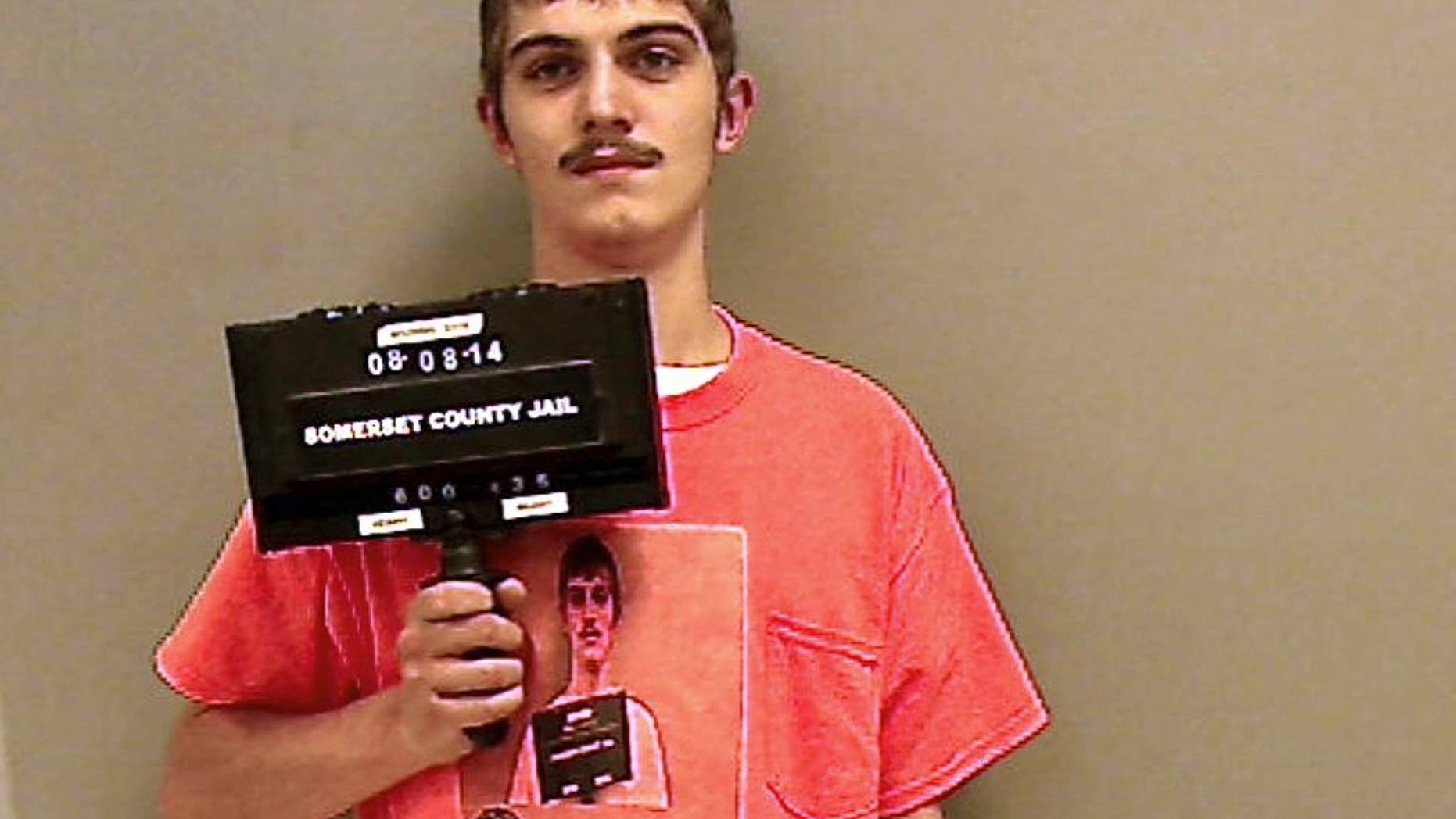 This Aug. 8, 2014 booking photo released by the Somerset County Sheriff’s Department shows Robert Burt, of Pittsfield, Maine, as he reported to serve jail time in Madison, Maine, for a June arrest for operating under the influence while driving. Burt arrived wearing a T-shirt bearing his mug shot that was made at the time of the June arrest. (AP Photo/Somerset County Sheriff’s Department)
