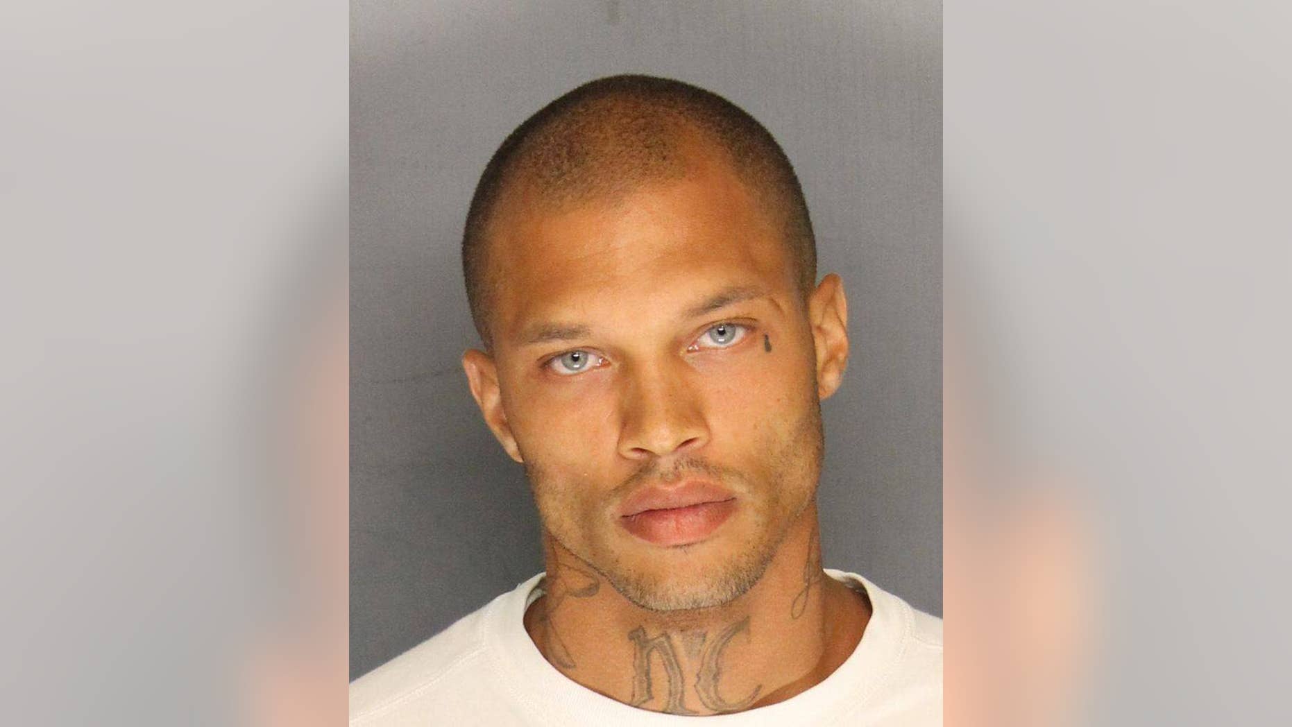 In this Wednesday, June 18, 2014, booking photo released by the Stockton Police Department is Jeremy Meeks. Meeks, 30, was one of four men arrested Wednesday in raids in Stockton, Calif.. On Thursday, his mugshot had more than 20,000 likes, nearly 6,000 comments, and had been shared more than 1,400 times on Facebook. (AP Photo/Stockton Police Department)