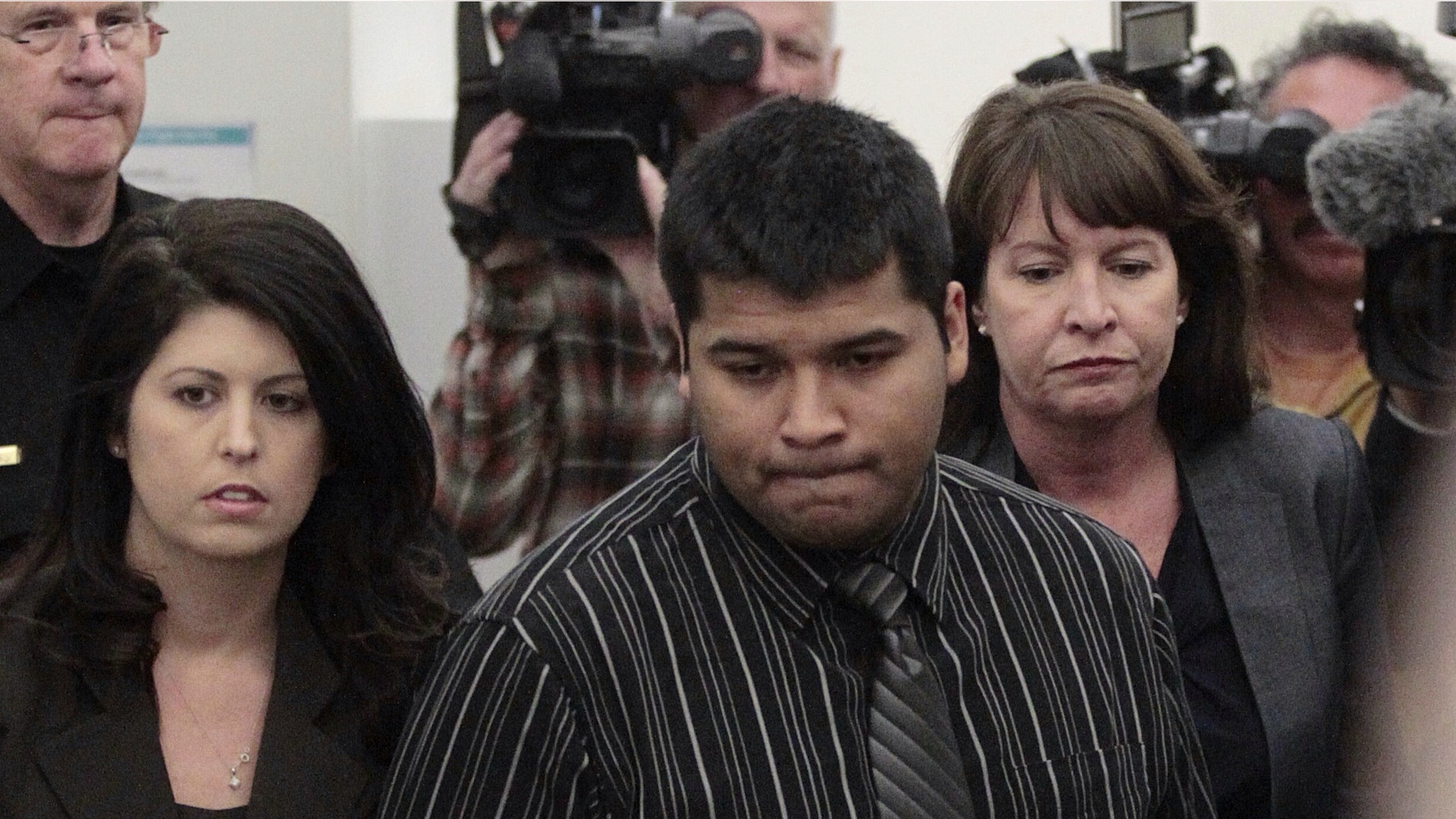 Erick Munoz arrives for a court hearing to possibly decide if his wife is removed from life support in Fort Worth, Texas on Friday, Jan. 24, 2014. Attorneys for the Fort Worth-area family will ask a judge to allow a pregnant, brain-dead Texas woman to be removed from life support, despite hospital opposition. State District Judge R.H. Wallace will hear arguments as the husband of Marlise Munoz seeks to remove her from life support. Munoz remains connected to machines. (AP Photo/Star-Telegram, Ron T. Ennis)