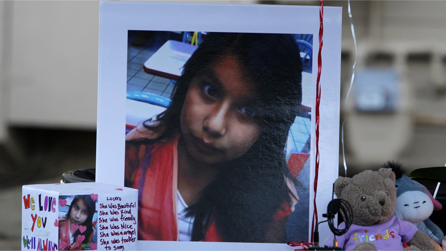 A picture of Lucero Gutierrez, an 11-year-old who was killed in a murder-suicide by her brother Abel Gutierrez, is part of a memorial in Gilroy, Calif., on Thursday, March 15, 2012. Investigators said they were searching for the mother of the shooter who they fear also may have been killed or seriously injured. (AP Photo/Nhat V. Meyer/Staff)
