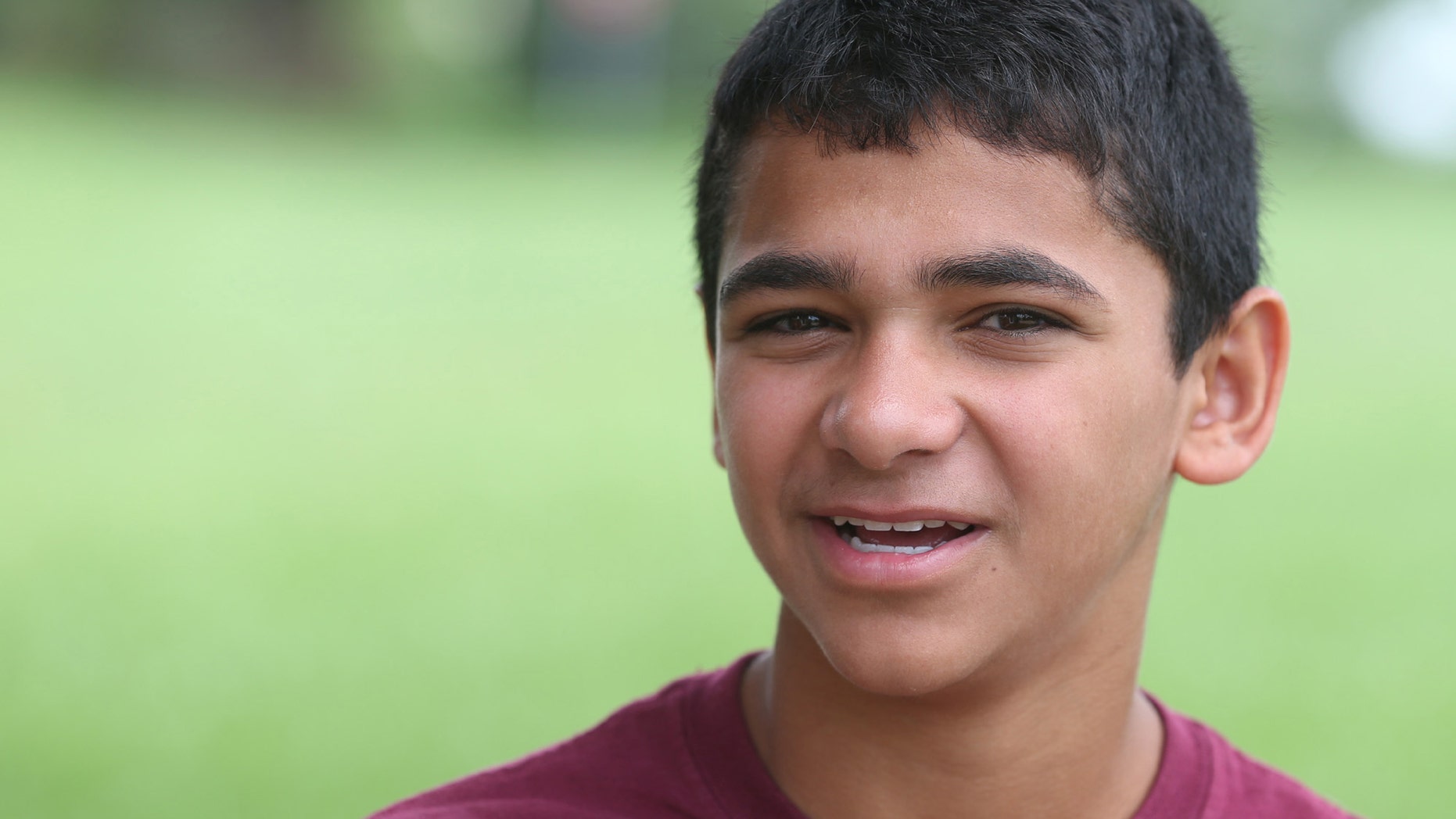 In this June 23, 2015 photo, John Handley High School sophomore Joseph Rosenfeld poses for a photo at the school in Winchester, Va.