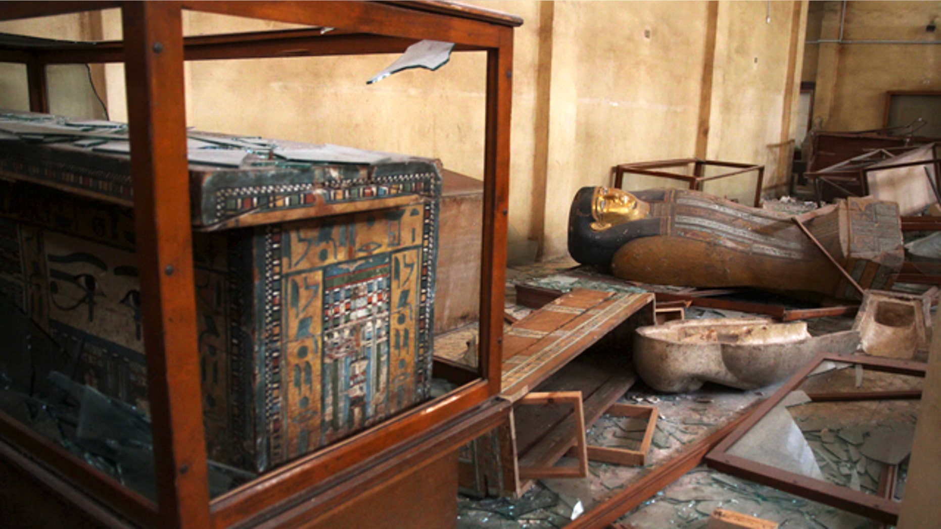 Aug. 17, 2013: Damaged pharaonic objects lie on the floor and in broken cases in the Malawi Antiquities Museum after it was ransacked and looted.