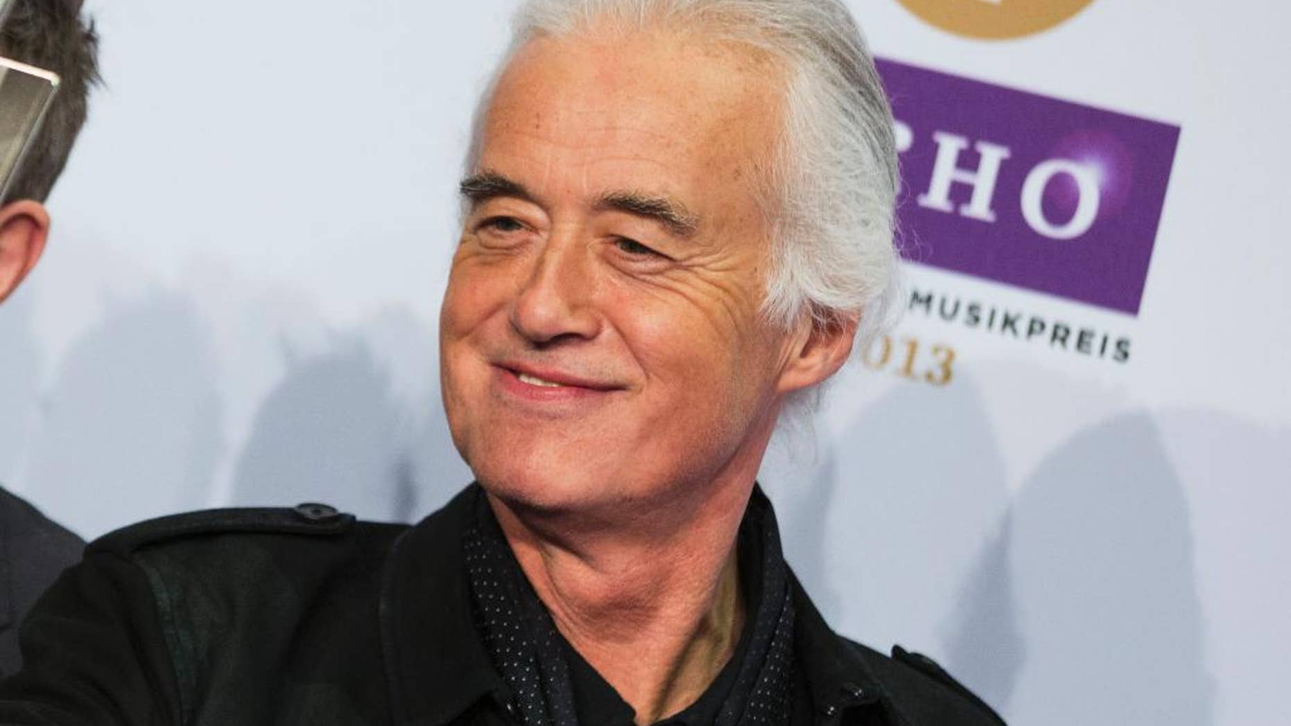 FILE - This March 21, 2013 file photo shows Jimmy Page, of Led Zeppelin, during the German Echo music award ceremony in Berlin, Germany. Page has remastered the band’s entire catalog. After spending the past couple of years listening to hundreds of hours of the band’s music, nine freshly mastered studio albums will be released in chronological order, three at a time. The first set arrives Tuesday, June 3. (AP Photo/Gero Breloer, File)