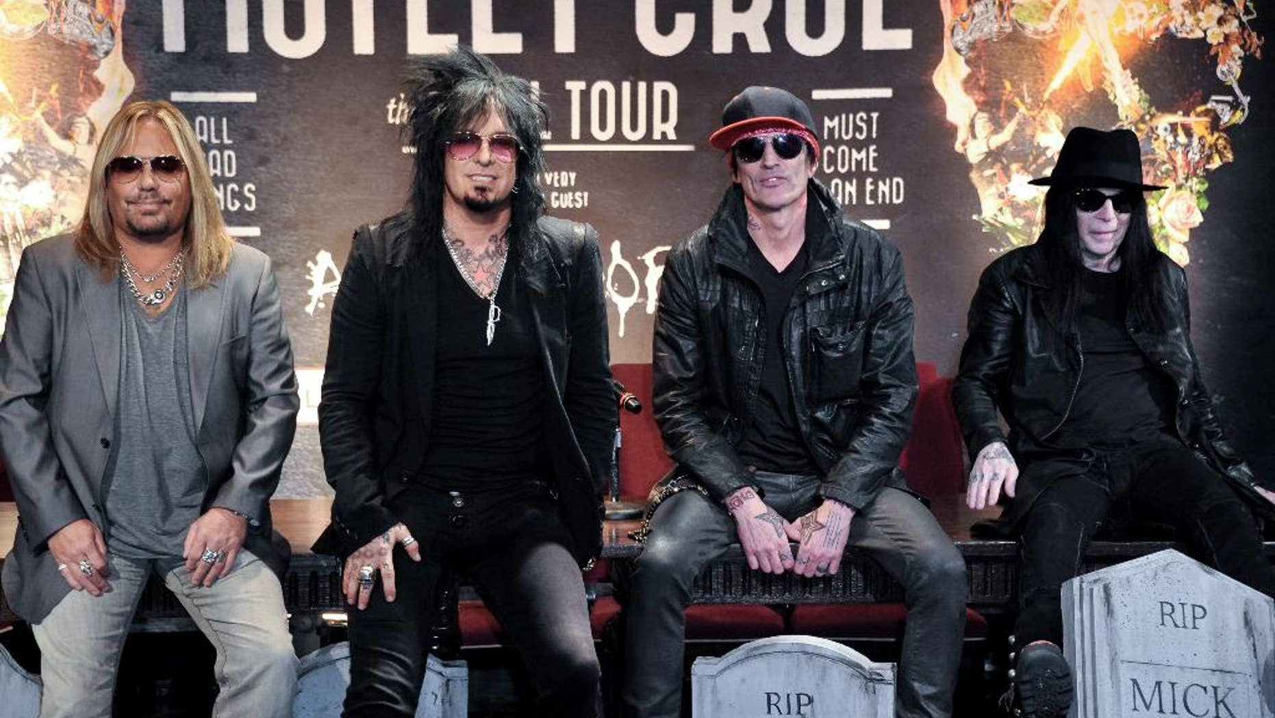 FILE - This Jan. 28, 2014 file photo shows, from left, Vince Neil, Nikki Sixx, Tommy Lee, and Mick Mars of Motley Crue at a press conference in Los Angeles. Country artists including Rascal Flatts, Florida Georgia Line and Brantley Gilbert perform on the 15-song album "Nashville Outlaws: A Tribute to Motley Crue," released Tuesday, Aug. 19. (Photo by Richard Shotwell/Invision/AP, File)