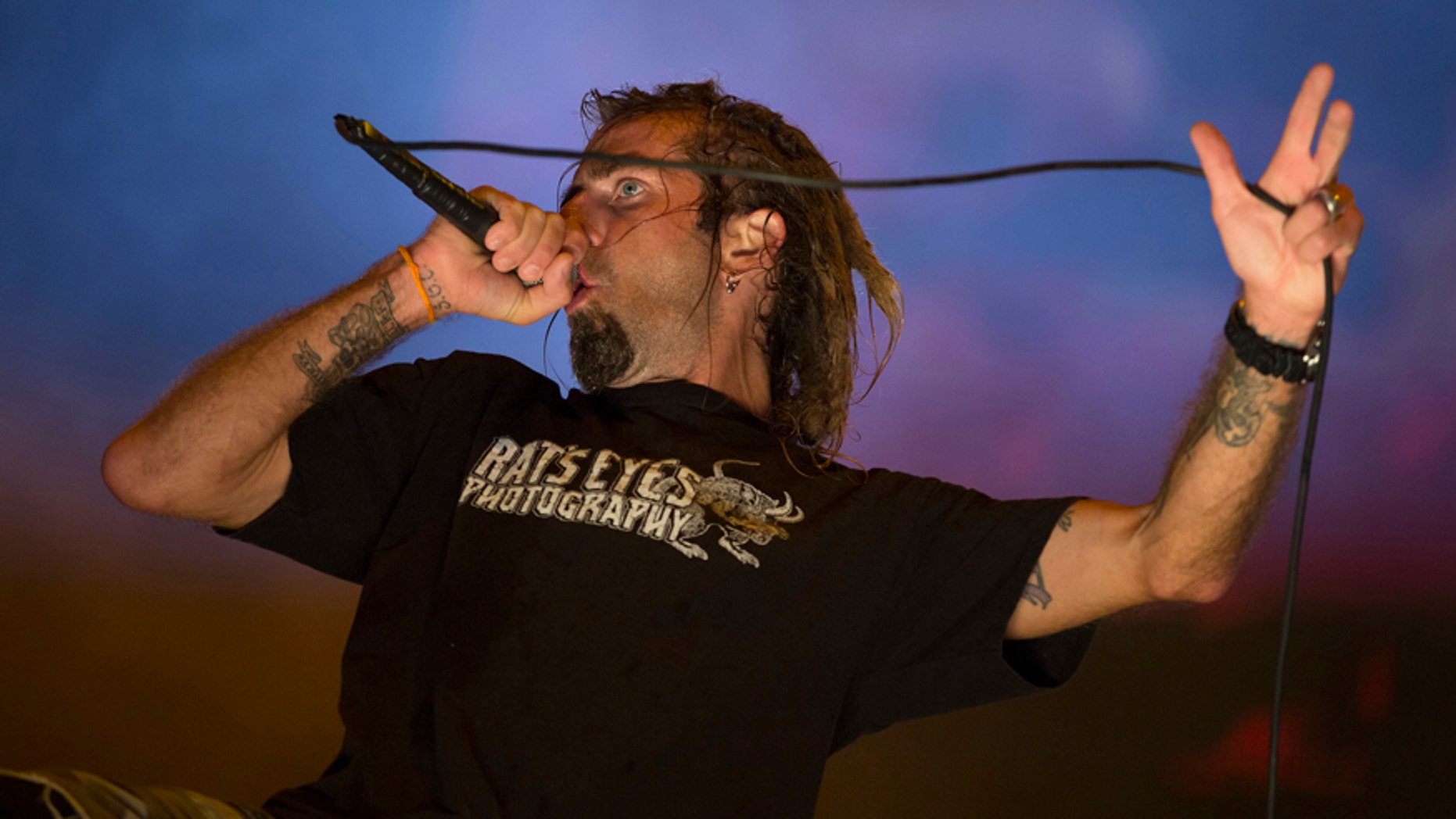 In this Sept. 24, 2015 photo, Randy Blythe of the heavy metal group Lamb of God performs at the Rock in Rio music festival in Rio de Janeiro, Brazil.