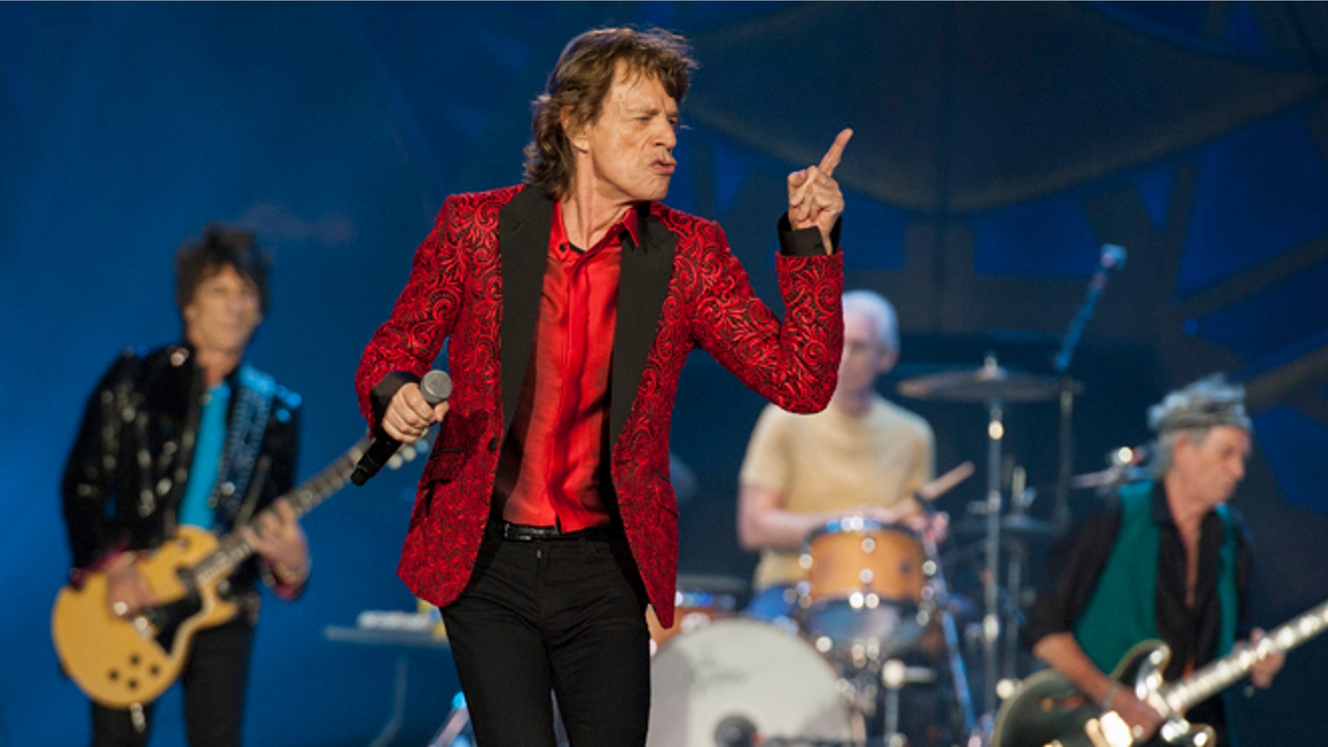 FILE - In this July 4, 2015 file photo, Ronnie Wood, Mick Jagger, Charlie Watts and Keith Richards of the Rolling Stones perform at the Indianapolis Motor Speedway in Indianapolis. On Thursday, Nov. 5, 2015, the band announced âThe America Latina Oléâ tour, which will kick off Feb. 3 in Santiago, Chile. (Photo by Barry Brecheisen/Invision/AP)
