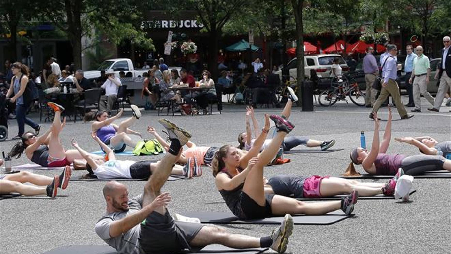 An exercise group from a YMCA in downtown Pittsburgh takes part in high-intensity interval training.