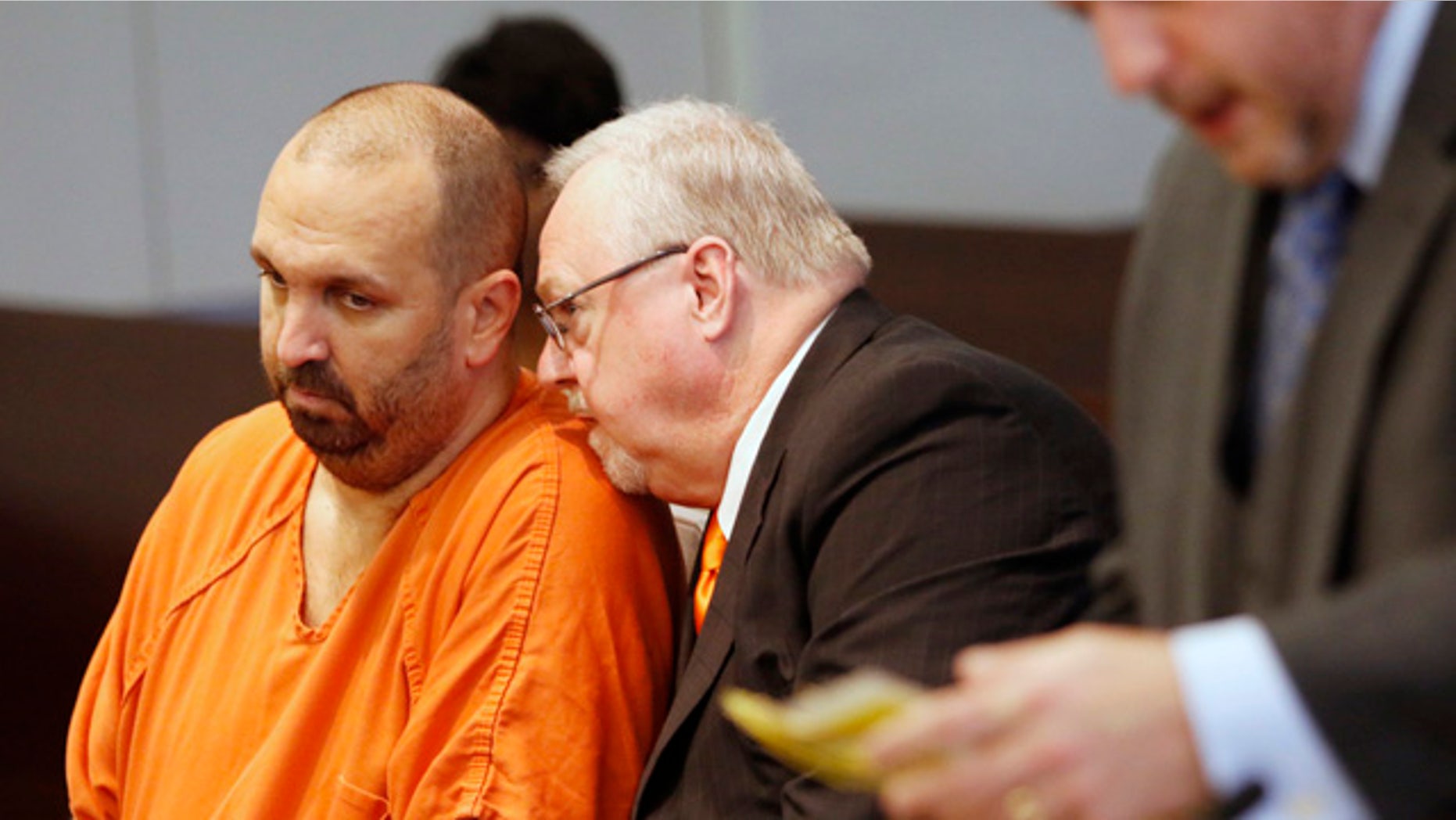 April 6, 2015: Murder defendant Craig Stephen Hicks, 46, left, listens to his co-defense counsel Terry Alford, center, during a death penalty hearing for Hicks in Durham Criminal Superior Court in Durham, N.C. (AP Photo/The News & Observer, Harry Lynch)