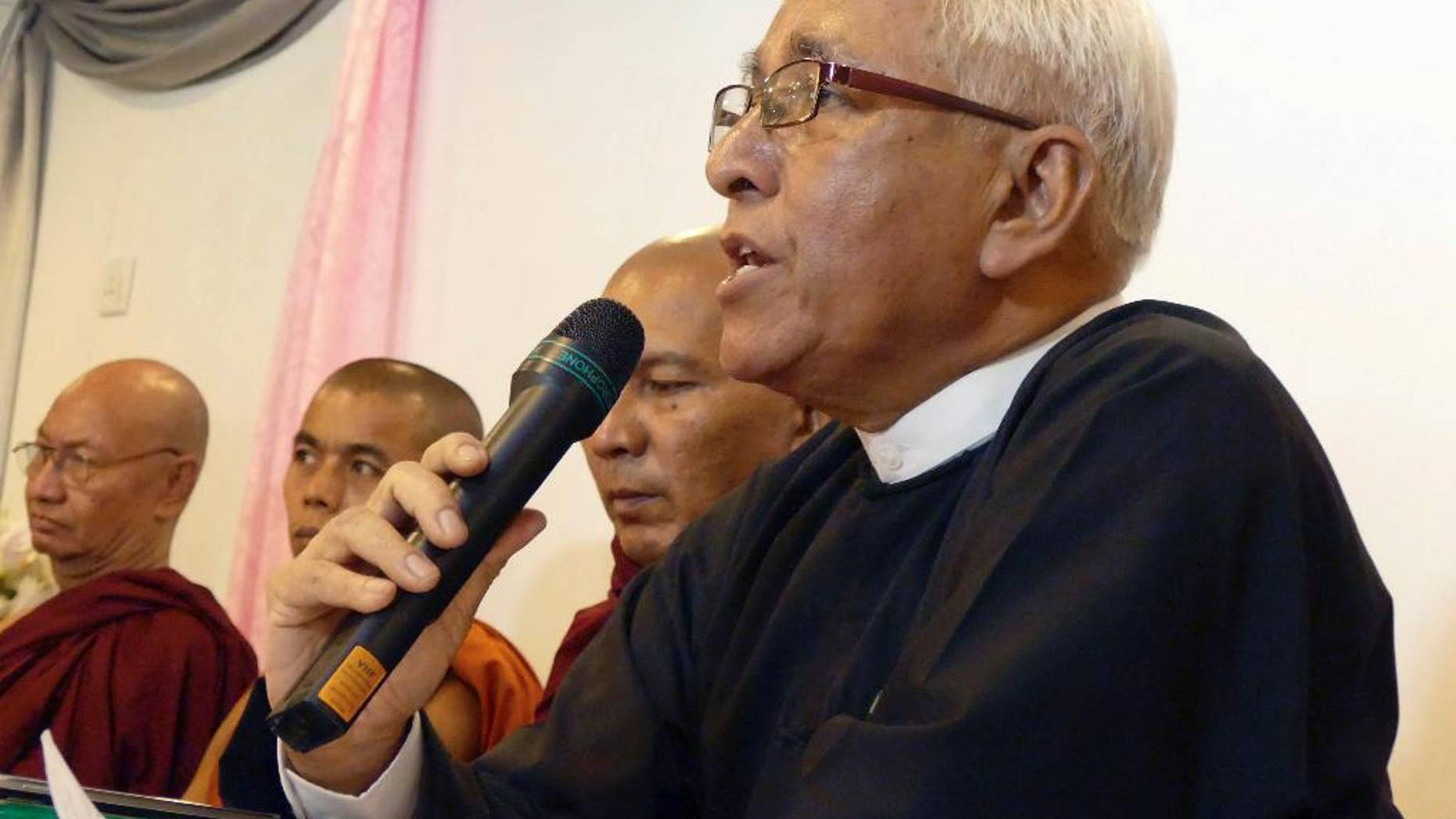 FILE - In this March 16, 2015 file photo, lawyer Aung Thein speaks during a press conference in Yangon, Myanmar. Police in northwestern Myanmar have rejected a lawsuit filed by two Buddhist monks against Myanmar's home minister and police chief, saying they are protected by law. In declining to accept a first information report, which is needed for a lawsuit to proceed, the police said no lawsuit can be brought against any officer who carries out acts in good faith. Human rights lawyer Aung Thein said Tuesday, March 24, 2015 that the two Buddhist monks, among scores seriously burned during a 2012 police crackdown on protests at a Chinese-backed copper mine, registered the first information report at the Hsalingyi police station. (AP Photo/Khin Maung Win, File)