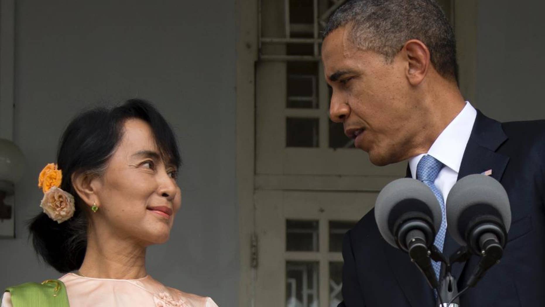 FILE - In this Nov. 19, 2012, file photo, U.S. President Barack Obama and Myanmar opposition leader Aung San Suu Kyi speak to press at her residence in Yangon, Myanmar. President Barack Obama’s first visit to Myanmar in 2012 was a celebration of the nation’s historic shift from military rule. But as Obama returns in 2014, optimism over economic and political reforms has faded. (AP Photo/Carolyn Kaster, File)