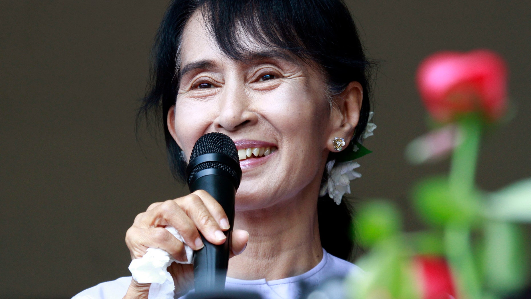 April 2, 2012: Myanmar pro-democracy leader Aung San Suu Kyi talks to supporters at the headquarters of her National League for Democracy party in Yangon, Myanmar.