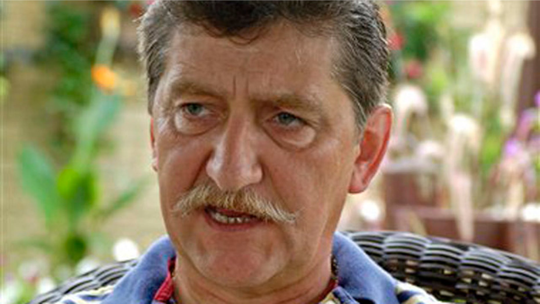 Aug. 12, 2010: Dr. Csaba Marosan answers a question during an interview in the backyard of his home in Williamsville, N.Y. Marosan says he was passed over forpromotions at Trocaire College for being heterosexual and then was fired for complaining.