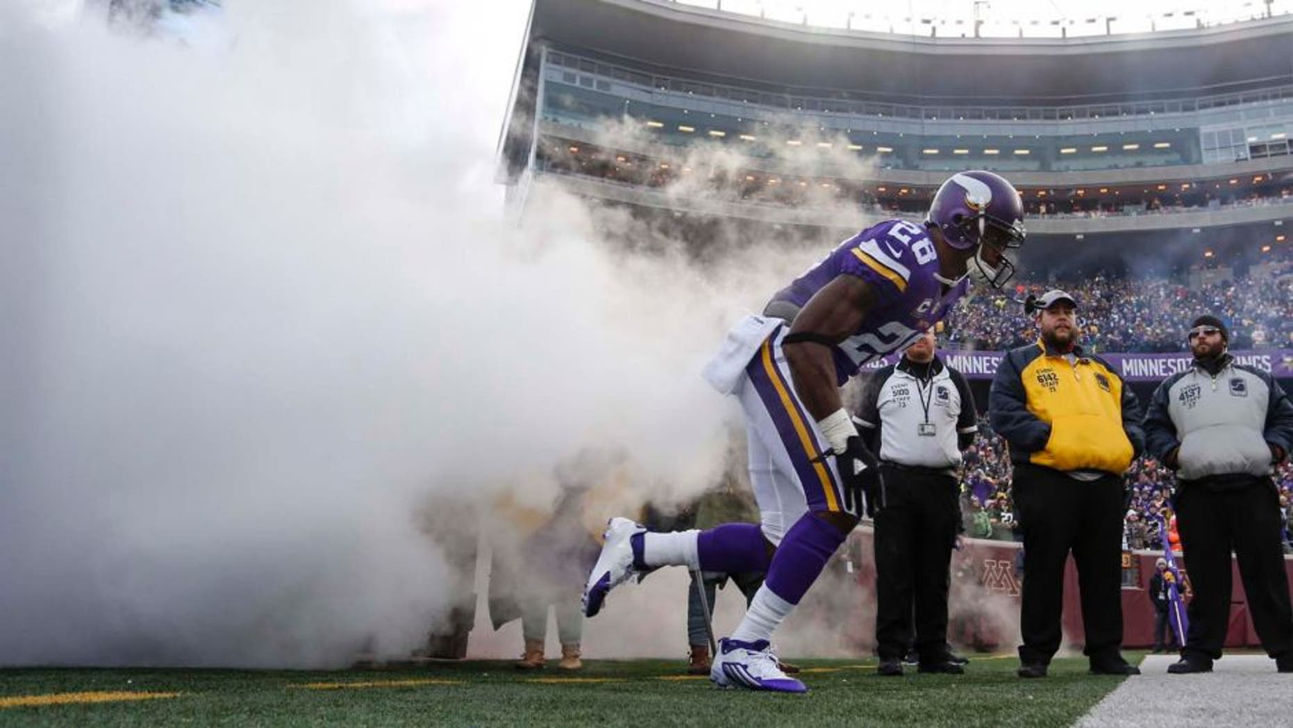 Sunday, Nov. 22: Minnesota Vikings running back Adrian Peterson comes onto the field out of a cloud of smoke to play the Green Bay Packers at TCF Bank Stadium in Minneapolis.