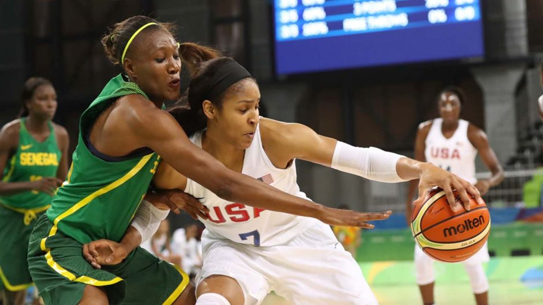 Sunday, Aug. 7, 2016: United States forward Maya Moore (right), of the Minnesota Lynx, is pressured by Senegal power forward Astou Traore during the Rio 2016 Summer Olympic Games at Youth Arena. Team USA set three Olympic records in a 121-56 win: Points scored in a game, margin of victory and assists.