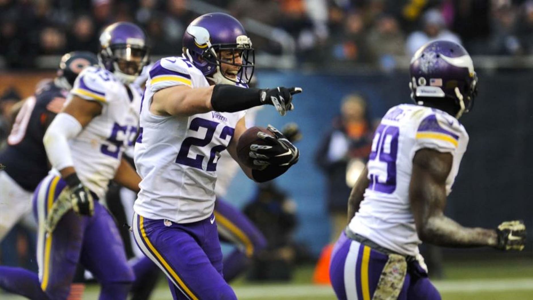 Sunday, November 16: Minnesota Vikings free safety Harrison Smith (center) intercepts a throw from Chicago Bears quarterback Jay Cutler (not pictured) in the second half of their game at Soldier Field. The Bears won 21-13.
