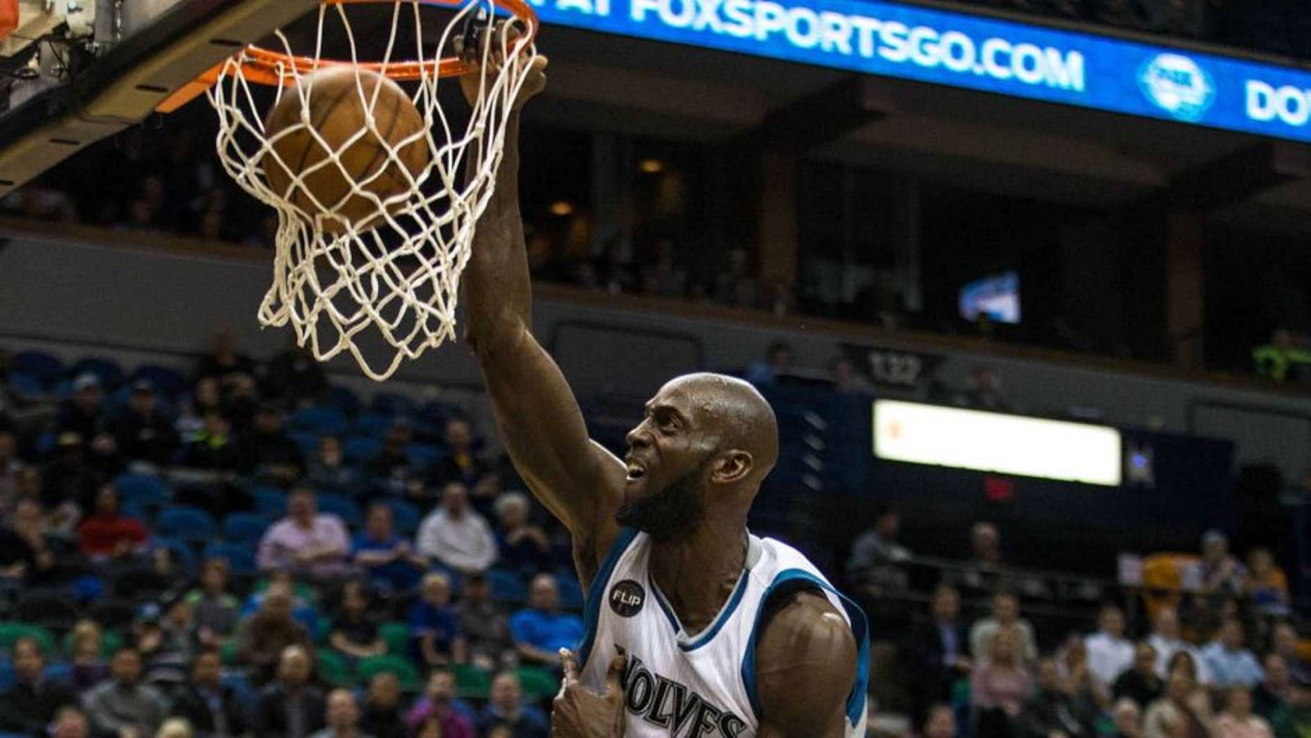 Monday, Dec. 7: Minnesota Timberwolves forward Kevin Garnett dunks over Los Angeles Clippers forward Blake Griffin during the third quarter at Target Center.