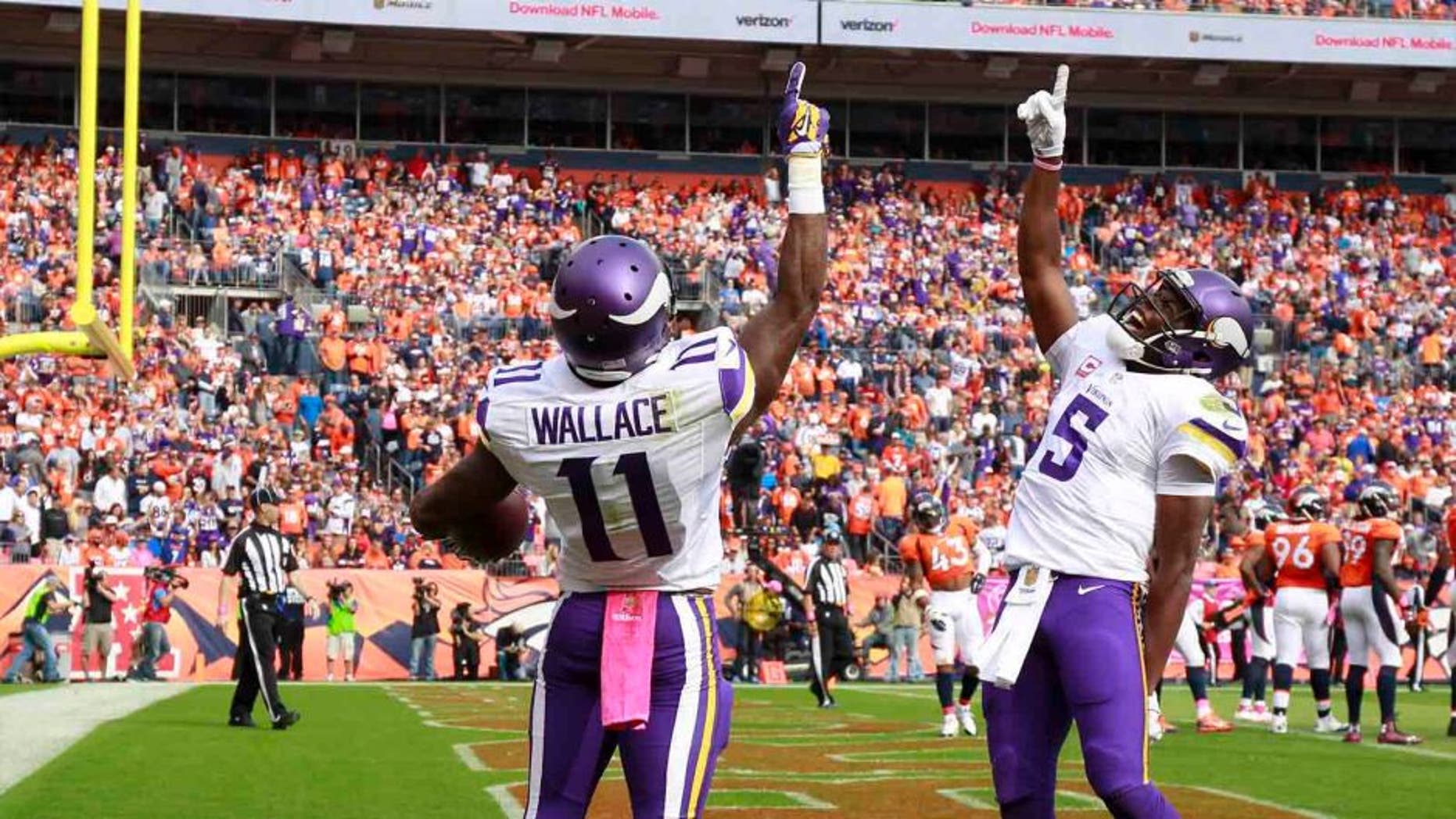 Sunday, Oct. 4: Minnesota Vikings wide receiver Mike Wallace celebrates after scoring with quarterback Teddy Bridgewater during the first half against the Denver Broncos.