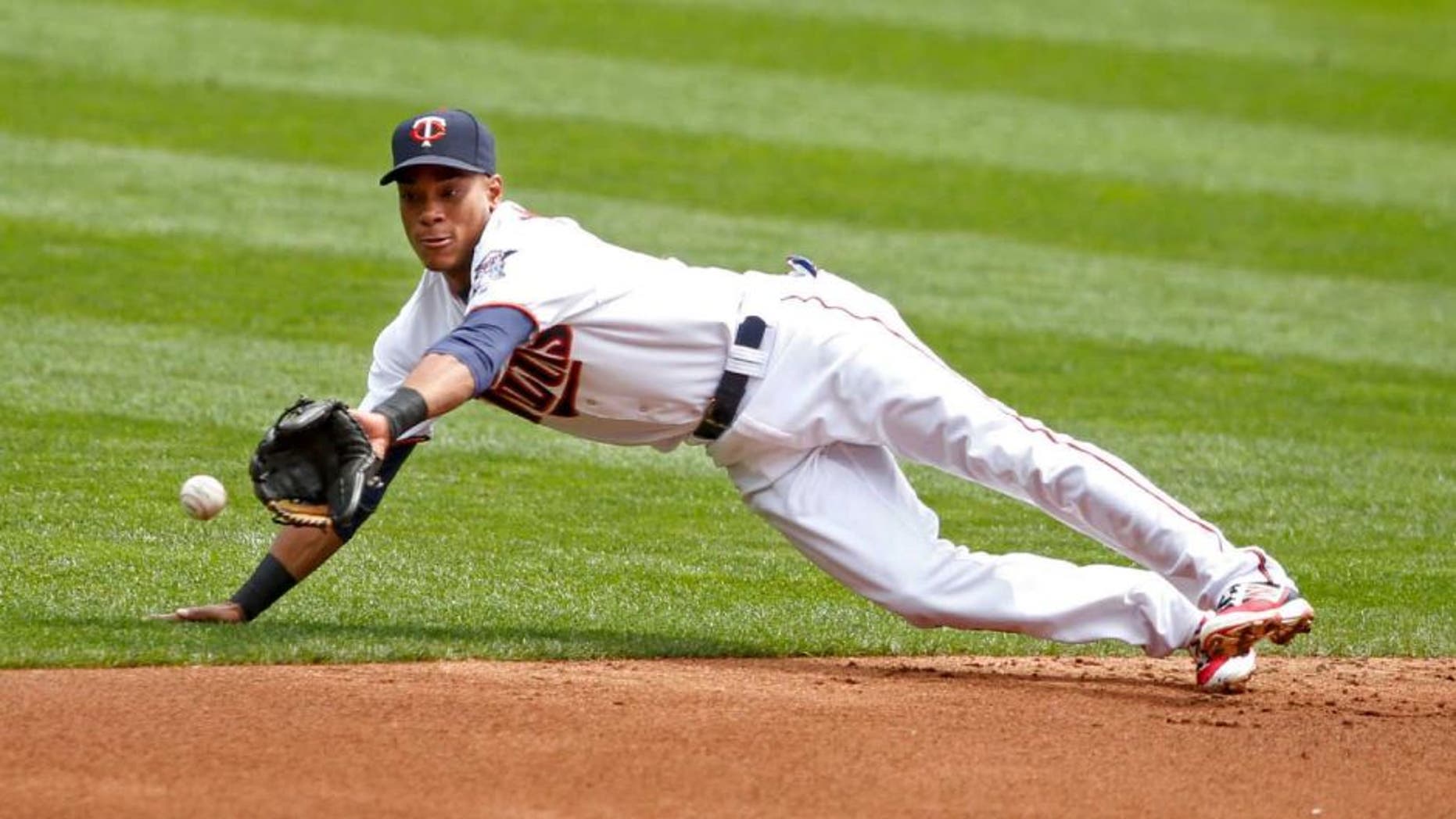 Thursday, Aug. 25, 2016: Minnesota Twins shortstop Jorge Polanco dives for a single by Detroit Tigers catcher James McCann (not pictured) in the second inning at Target Field. The Twins lost 8-5.
