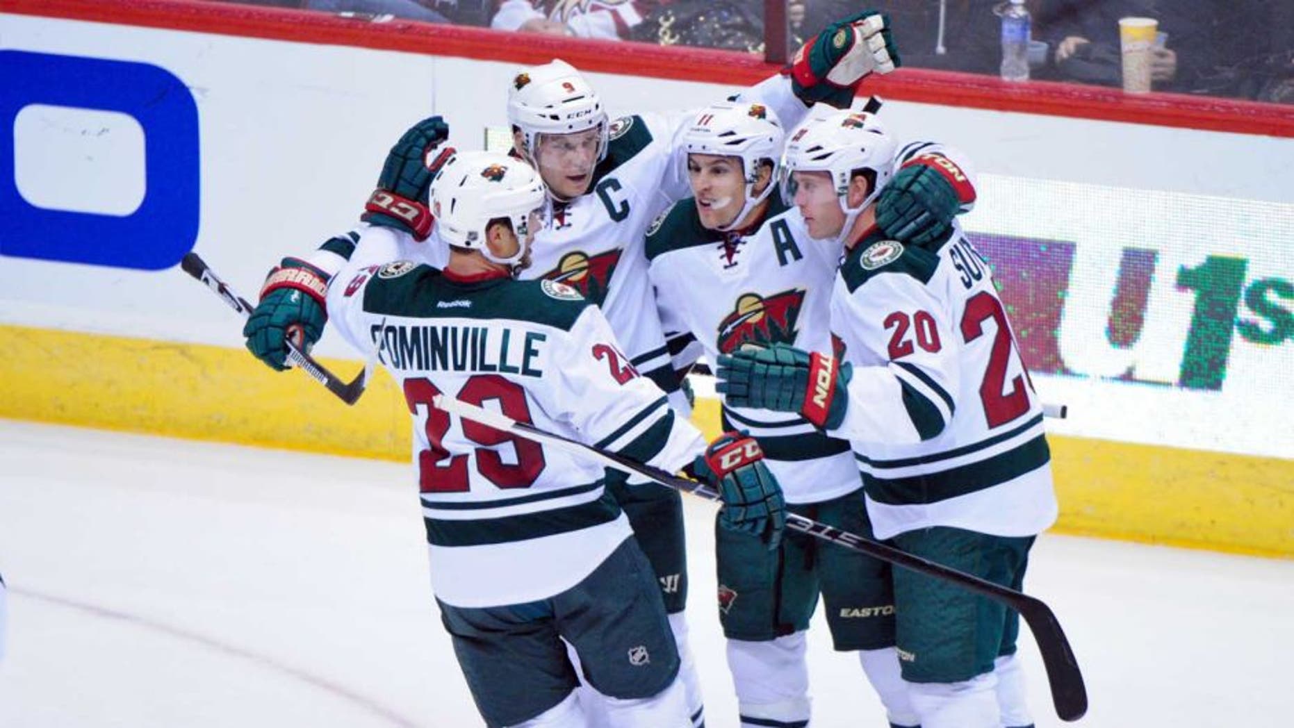 Thursday, Oct. 15: Minnesota Wild left wing Zach Parise (second from right) celebrates with right wing Jason Pominville (left), defenseman Ryan Suter (right) and center Mikko Koivu after scoring a power play goal in the first period against the Arizona Coyotes at Gila River Arena.