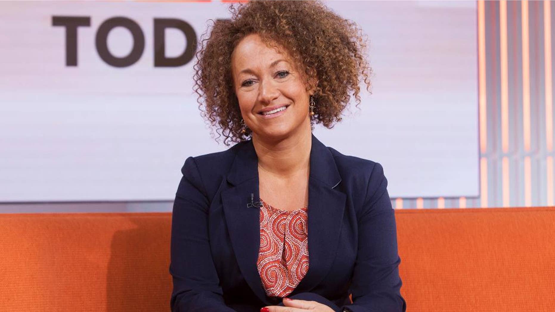 In this image released by NBC News, former NAACP leader Rachel Dolezal appears on the "Today" show set on Tuesday, June 16, 2015, in New York. Dolezal was born to two parents who say they are white, but she chooses instead to self-identify as black. Her ability to think she has a choice shows a new fluidity in race in a diversifying America, a place where the rigid racial structures that defined most of this country’s history seems, for some, to be falling to the wayside. (Anthony Quintano/NBC News via AP)