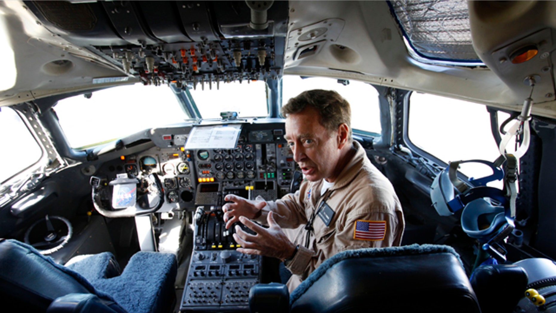 Flight engineer Bill Fleming sits in a plane cockpit as a team of NASA scientists prepare for a flight into Hurricane Earl to gather data about what makes some tropical storms intensify while others fizzle. The flight is part of a six-week NASA research mission to collect information that could help forecasters accurately predict how strong a hurricane will be.