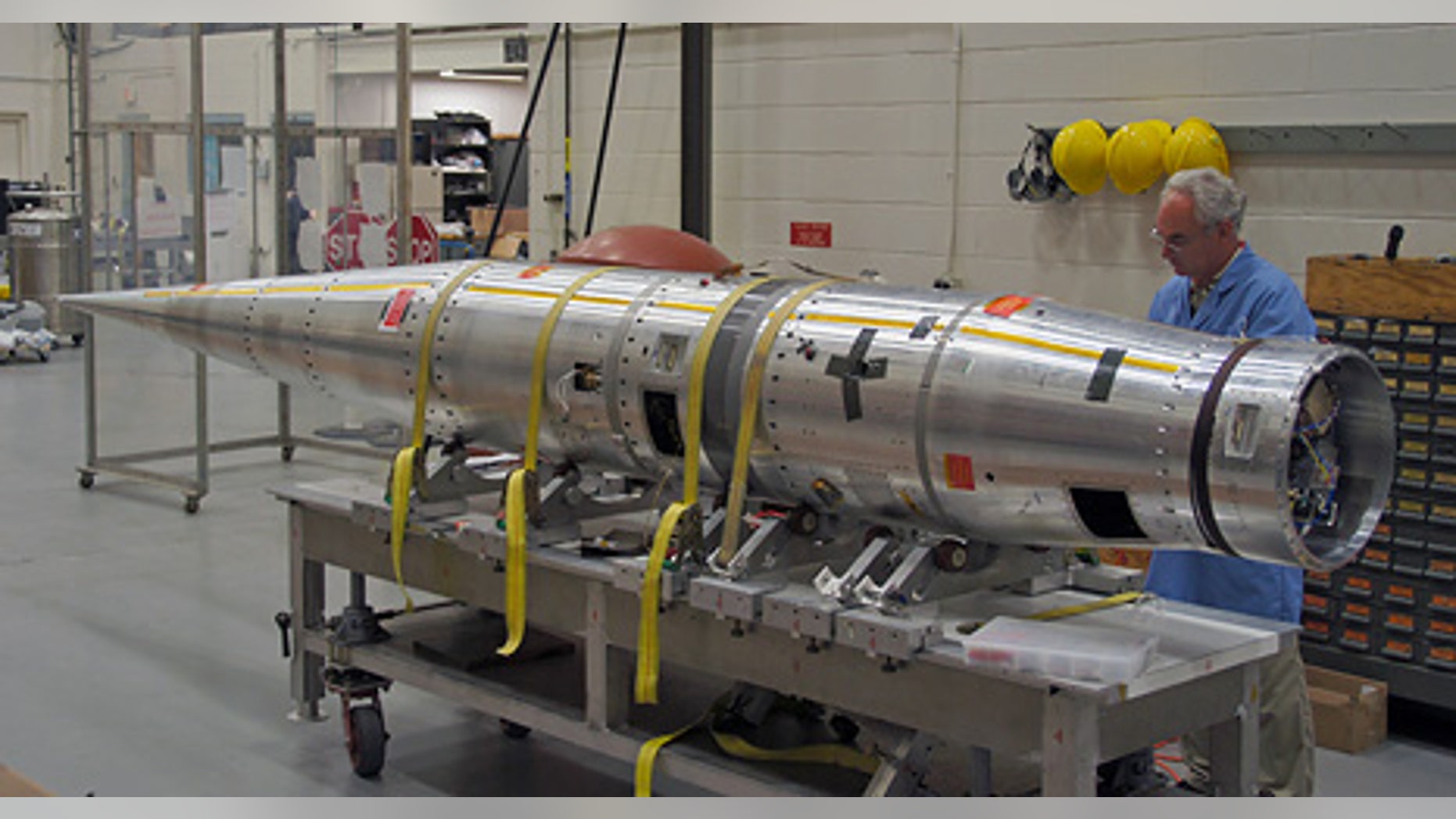 NASA technicians and engineers put the finishing touches on a unique experiment designed to demonstrate that an inflatable aeroshell/heat shield could be used to protect spacecraft when entering or leaving a planet's atmosphere.