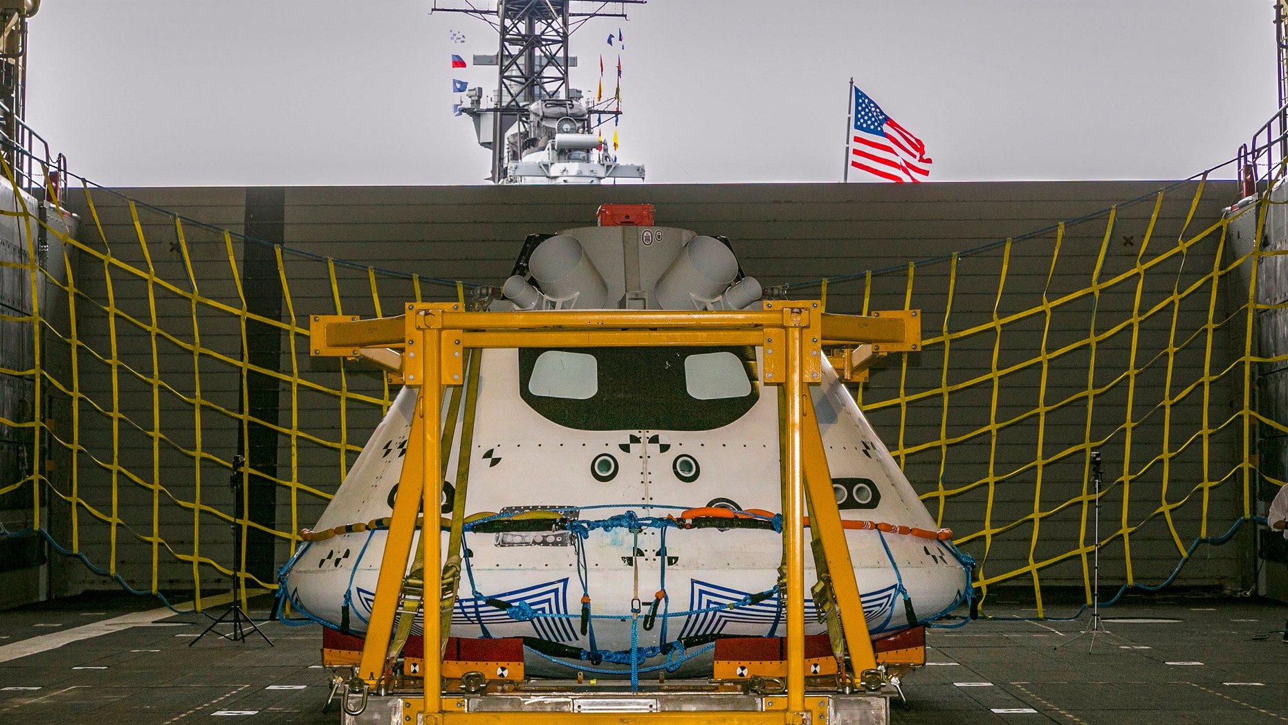 NASA's Orion spacecraft test vehicle sits in the well deck of the USS Anchorage at the Port of Los Angeles on Wednesday, Aug. 6, 2014. NASA, Lockheed Martin and the U.S. Navy will conduct recovery tests for the capsule in the Pacific Ocean, simulating its return from a space mission. (AP Photo/Damian Dovarganes)