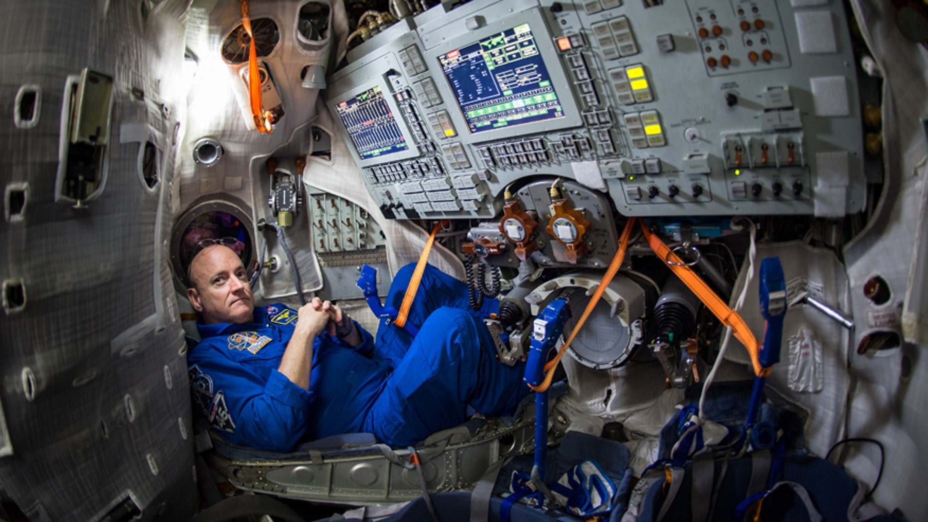 File photo - In this Wednesday, March 4, 2015 photo provided by NASA, astronaut Scott Kelly sits inside a Soyuz simulator at the Gagarin Cosmonaut Training Center (GCTC) in Star City, Russia.