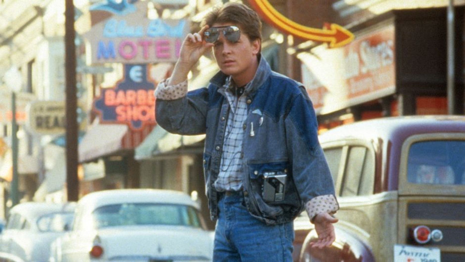 Michael J Fox walking across the street in a scene from the film 'Back To The Future', 1985. (Photo by Universal/Getty Images)