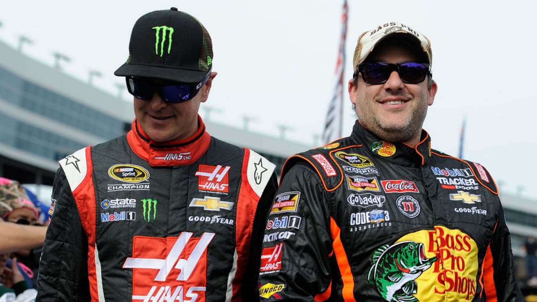 FORT WORTH, TX - NOVEMBER 02: Kurt Busch, driver of the #41 Haas Automation Chevrolet, and Tony Stewart, driver of the #14 Bass Pro Shops / Mobil 1 Chevrolet, during the NASCAR Sprint Cup Series AAA Texas 500 at Texas Motor Speedway on November 2, 2014 in Fort Worth, Texas. (Photo by Jared C. Tilton/NASCAR via Getty Images)