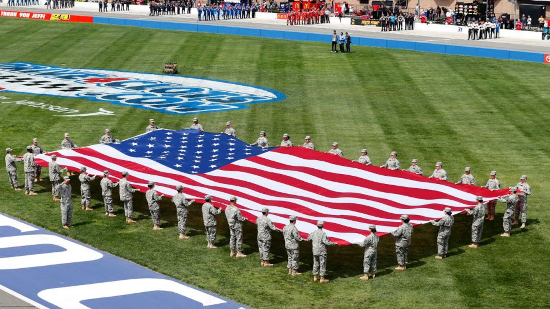 FONTANA, CA - MARCH 22: A view of the American flag during the National Anthem prior to the NASCAR Sprint Cup Series Auto Club 400 at Auto Club Speedway on March 22, 2015 in Fontana, California. (Photo by Todd Warshaw/NASCAR via Getty Images)