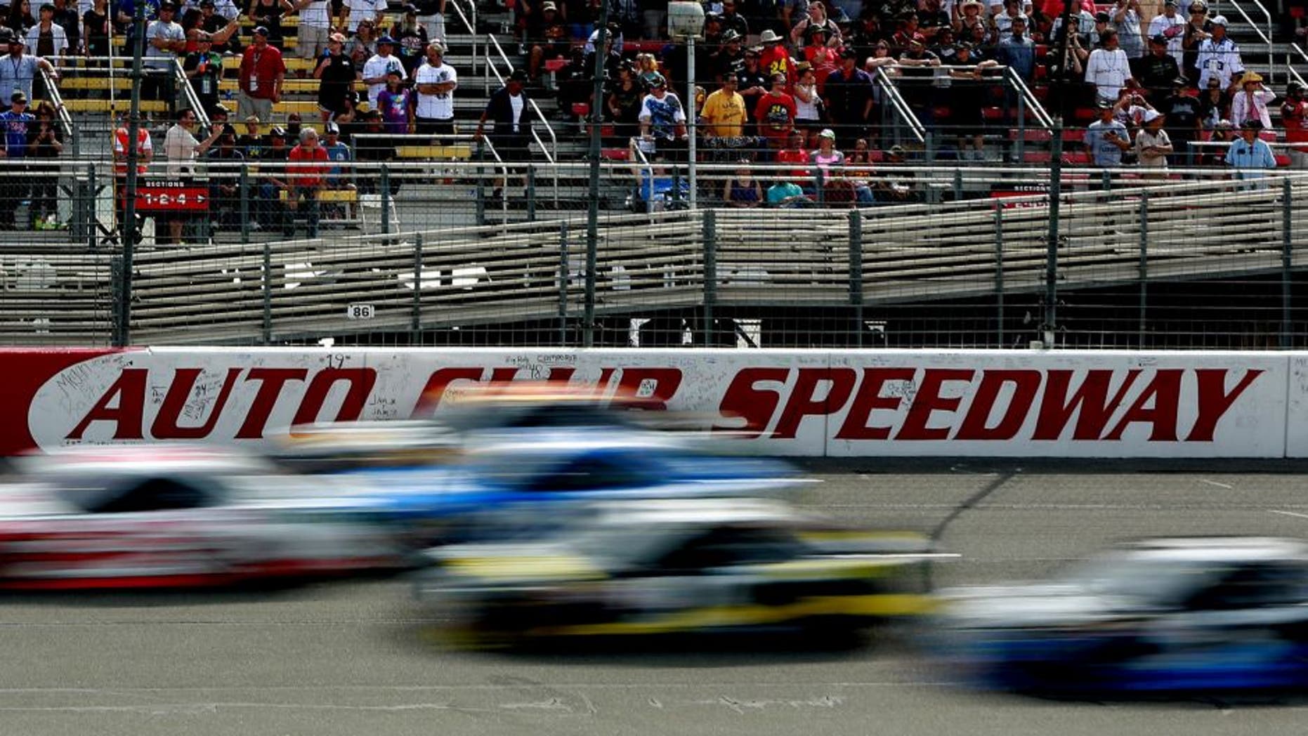 FONTANA, CA - MARCH 22: A view of cars racing during the NASCAR Sprint Cup Series Auto Club 400 at Auto Club Speedway on March 22, 2015 in Fontana, California. (Photo by Jerry Markland/Getty Images)