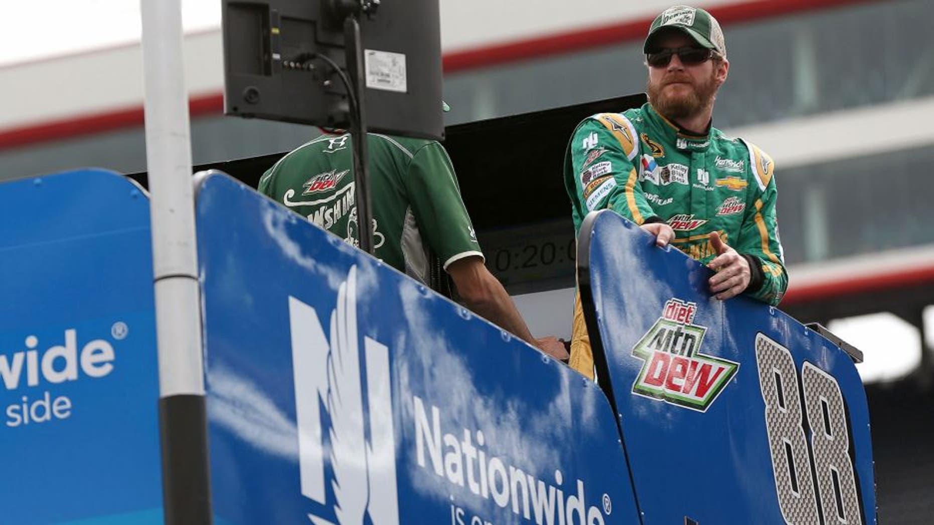 BRISTOL, TN - APRIL 17: Dale Earnhardt Jr., driver of the #88 Mountain Dew Dewshine Chevrolet, stands on top of his hauler prior to qualifying for the NASCAR Sprint Cup Series Food City 500 at Bristol Motor Speedway on April 17, 2015 in Bristol, Tennessee. (Photo by Mike Ehrmann/Getty Images)